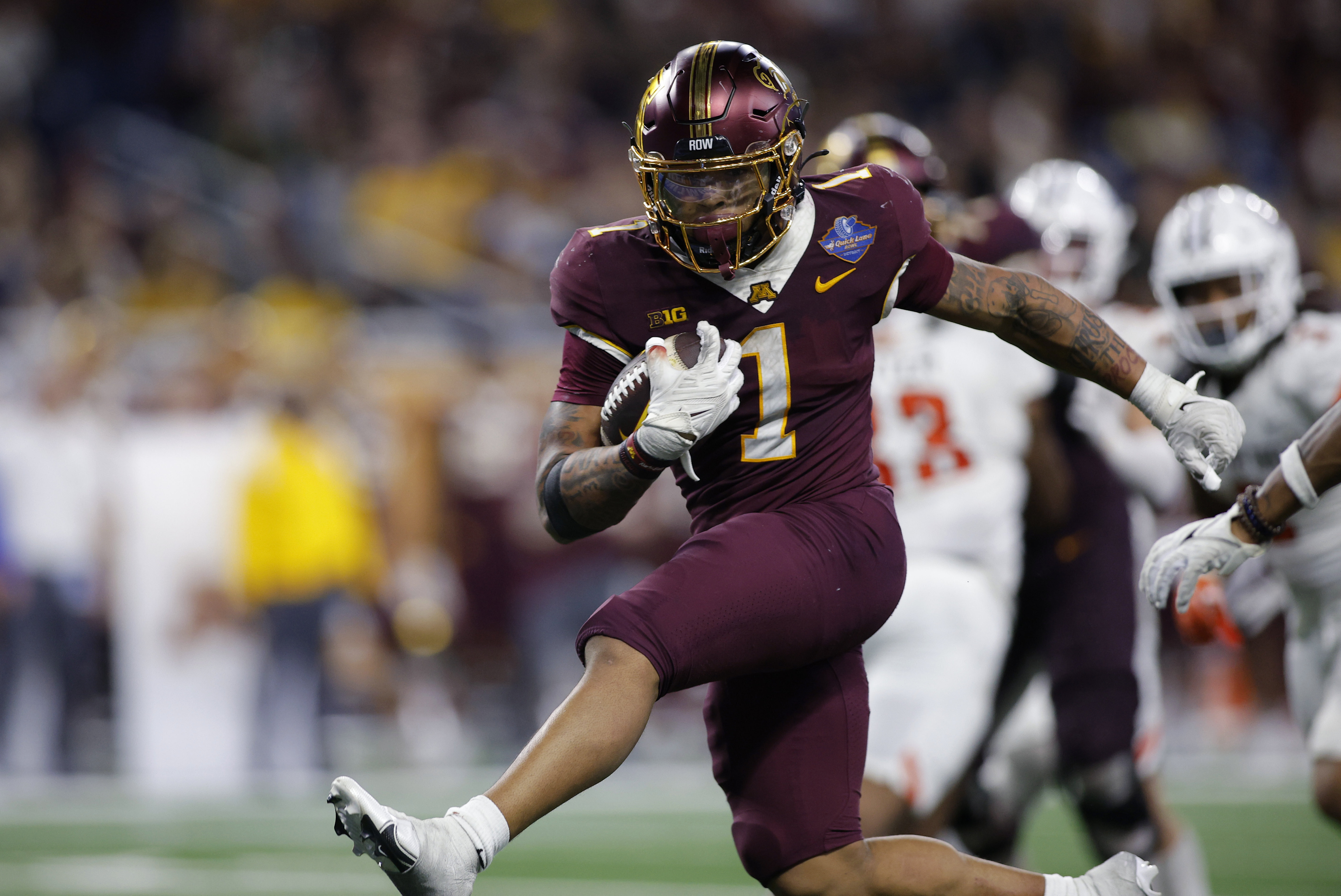FILE - Minnesota running back Darius Taylor runs for a touchdown against Bowling Green during the second half of the Quick Lane Bowl NCAA college football game, Tuesday, Dec. 26, 2023, in Detroit. 