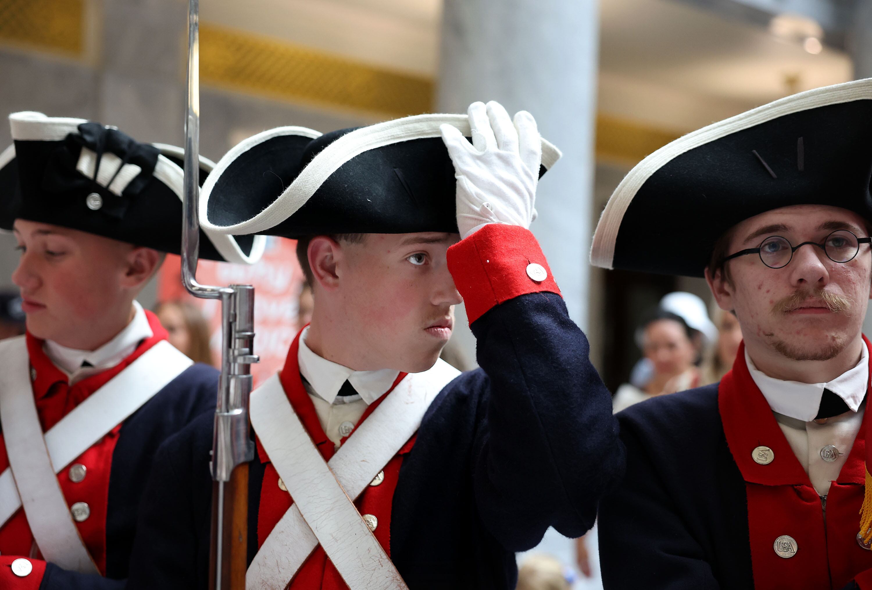 Utah Society Sons of the American Revolution members Cole Duffield, left, Quinn Rodeffer and Joshua Adam Elliott prepare to present the flag at the Founders of America and Constitution Month Kick-Off at the Capitol in Salt Lake City on Thursday.