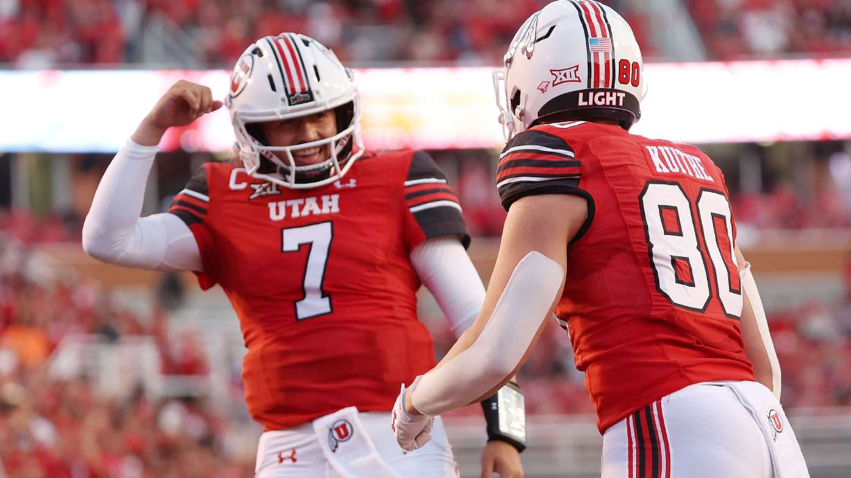 Utah Utes tight end Brant Kuithe (80) celebrates his touchdown with Utah Utes quarterback Cameron Rising (7) against SUU in Salt Lake City on Thursday, Aug. 29, 2024. Utah won 49-0.