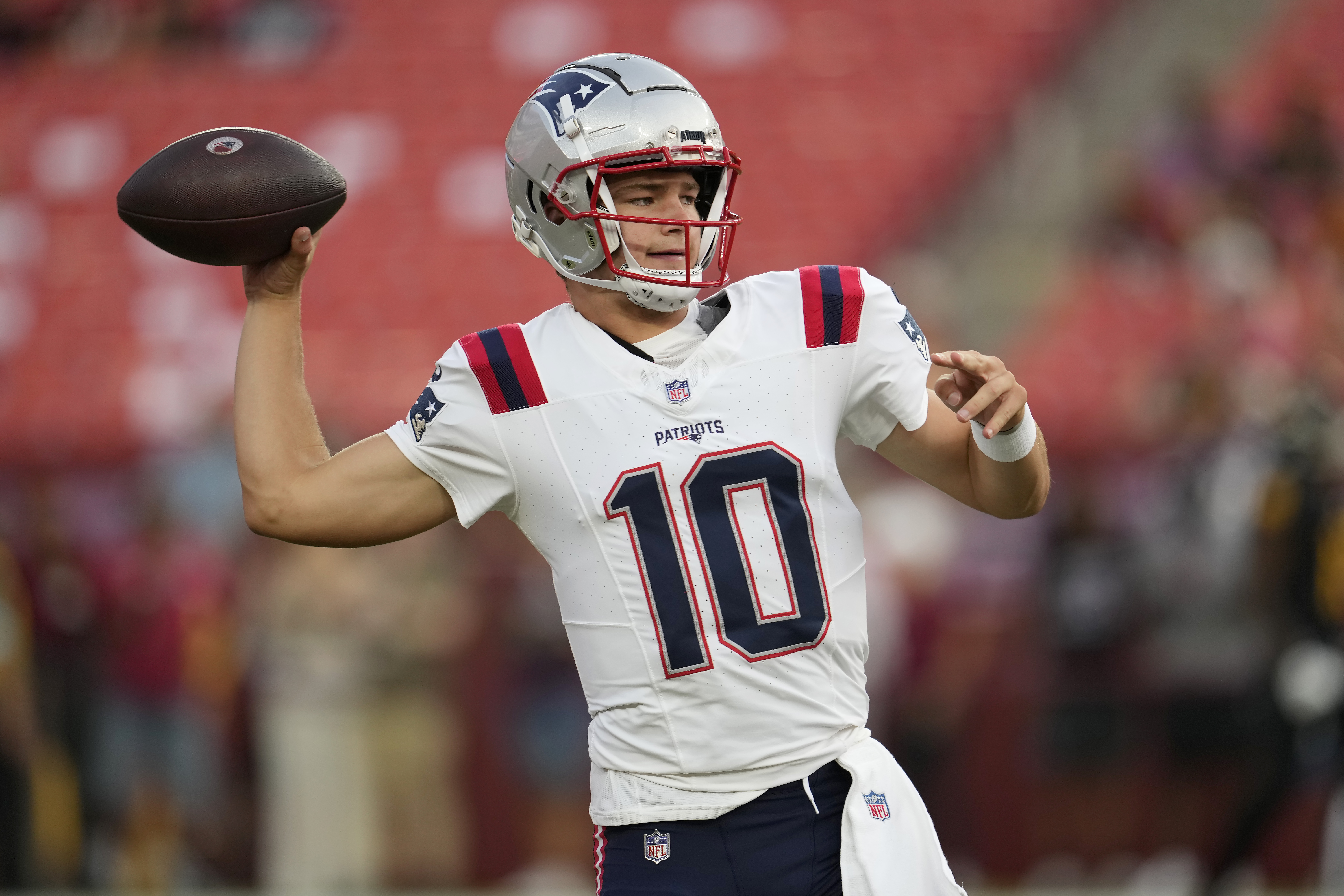 New England Patriots quarterback Drake Maye warms up before a preseason NFL football game against the Washington Commanders, Sunday, Aug. 25, 2024, in Landover, Md. 