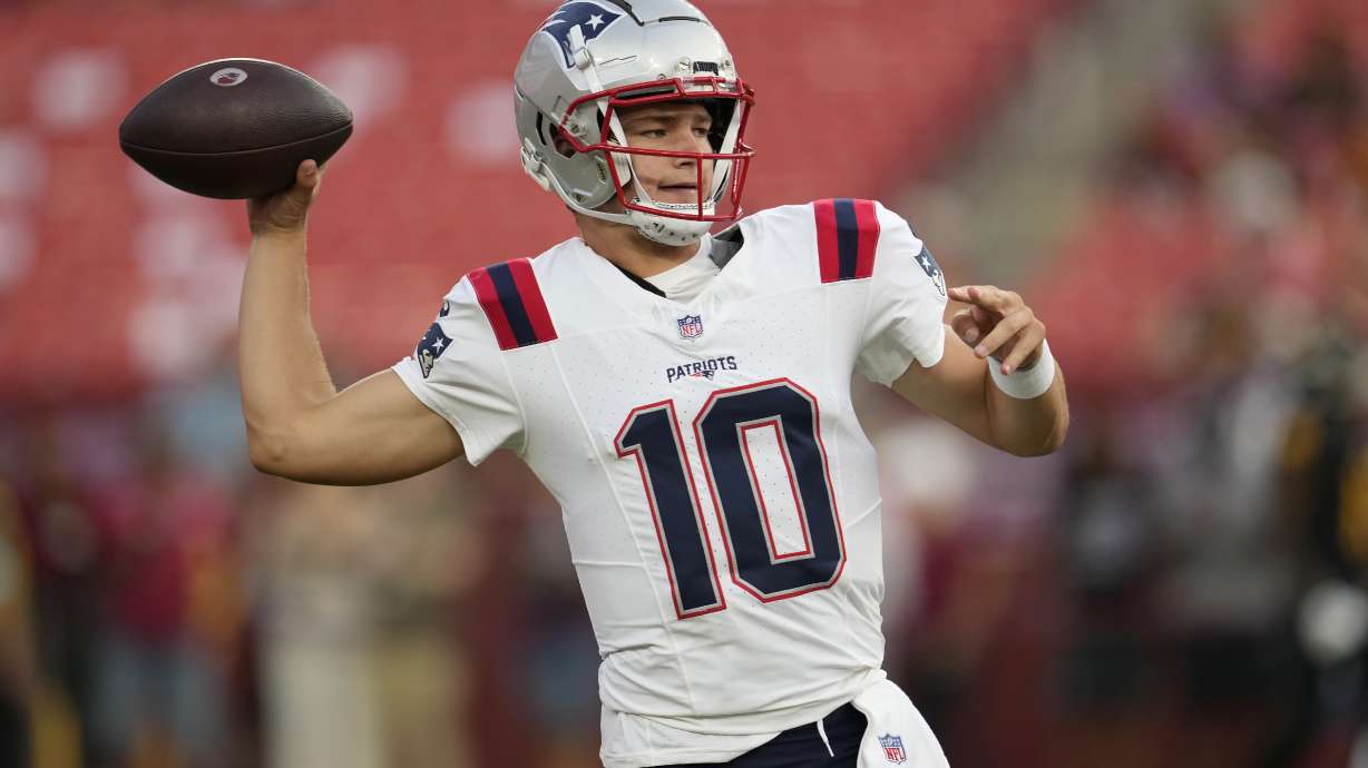 New England Patriots quarterback Drake Maye warms up before a preseason NFL football game against the Washington Commanders, Sunday, Aug. 25, 2024, in Landover, Md.