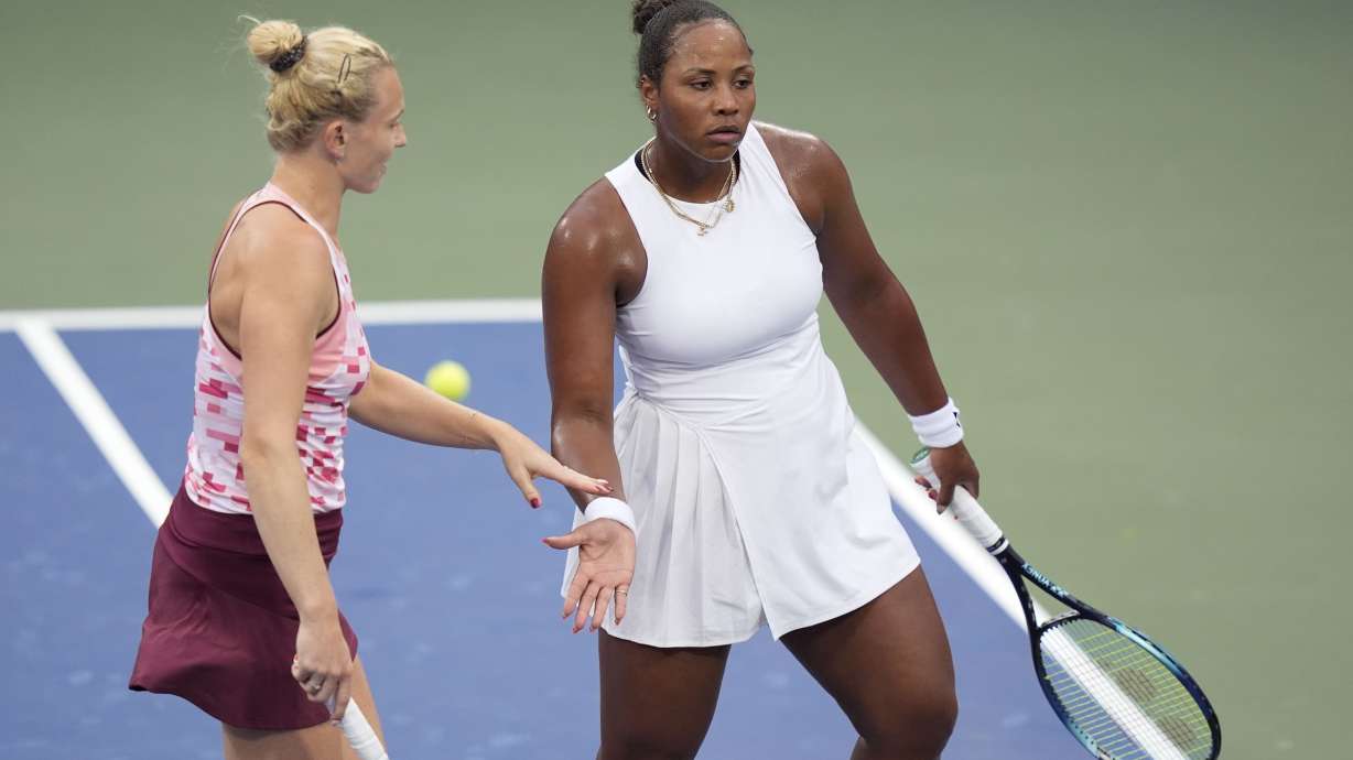 Katerina Siniakova, of the Czech Republic, and Taylor Townsend, of the United States, react during a second round match of the U.S. Open tennis championships, Thursday, Aug. 29, 2024, in New York.