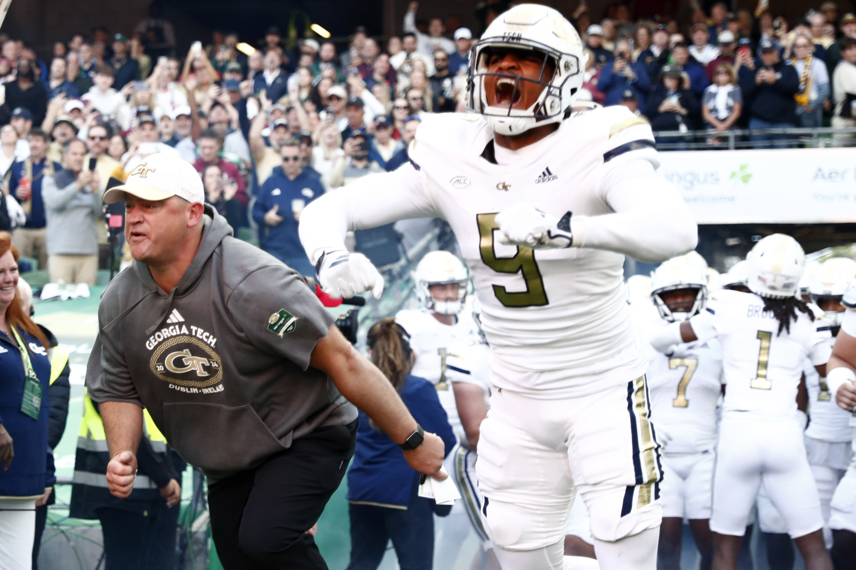 Georgia Tech head coach Brent Key and player Romello Height enter the pitch for the NCAA college football game between Georgia Tech and Florida State at the Aviva stadium Dublin, Saturday, Aug. 24, 2024.