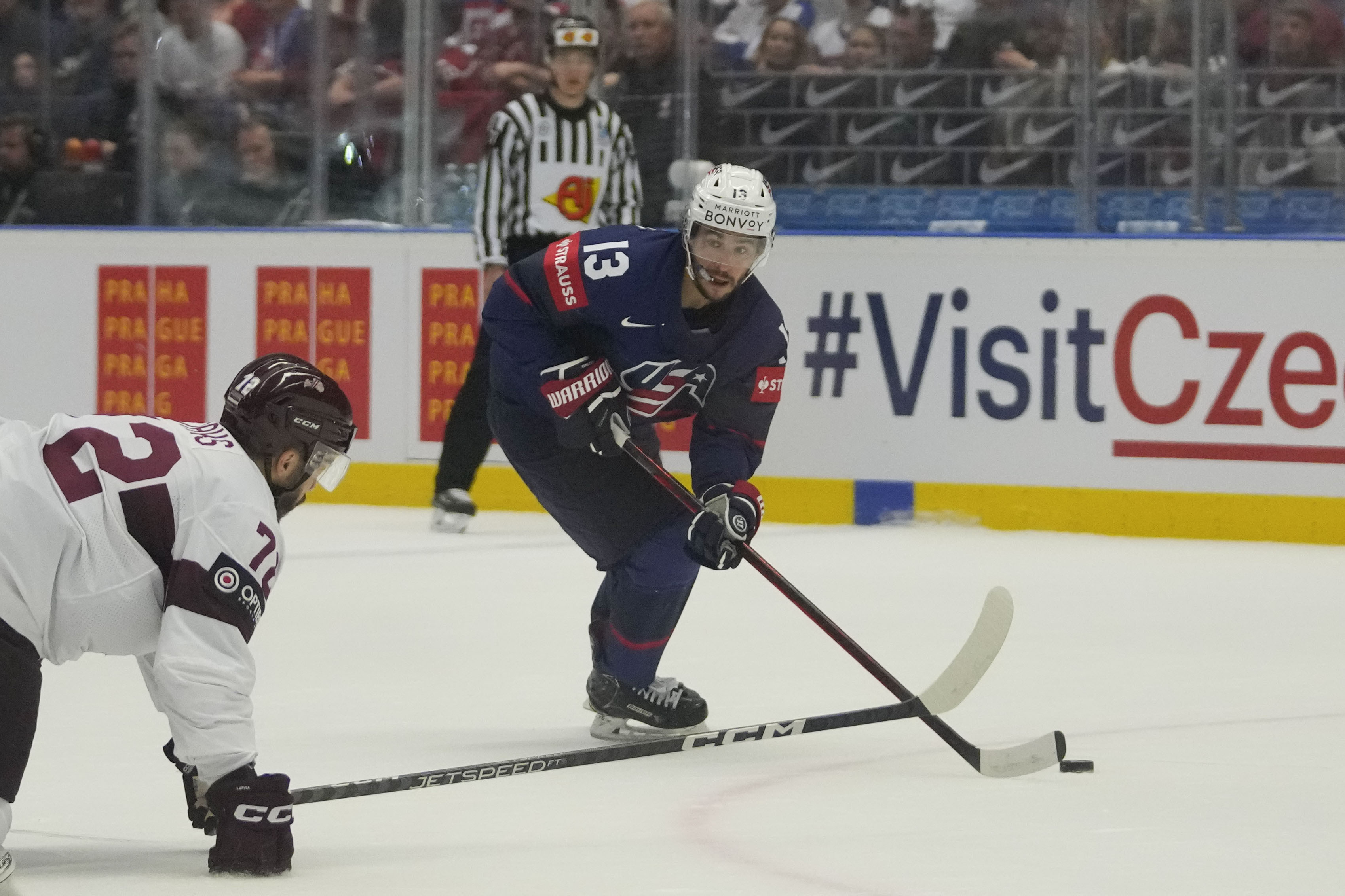 FILE - Unted States' Johnny Gaudreau, right, challenges for a puck with Latvia's Janis Jaks during the preliminary round match between Latvia and United States at the Ice Hockey World Championships in Ostrava, Czech Republic, Tuesday, May 21, 2024.