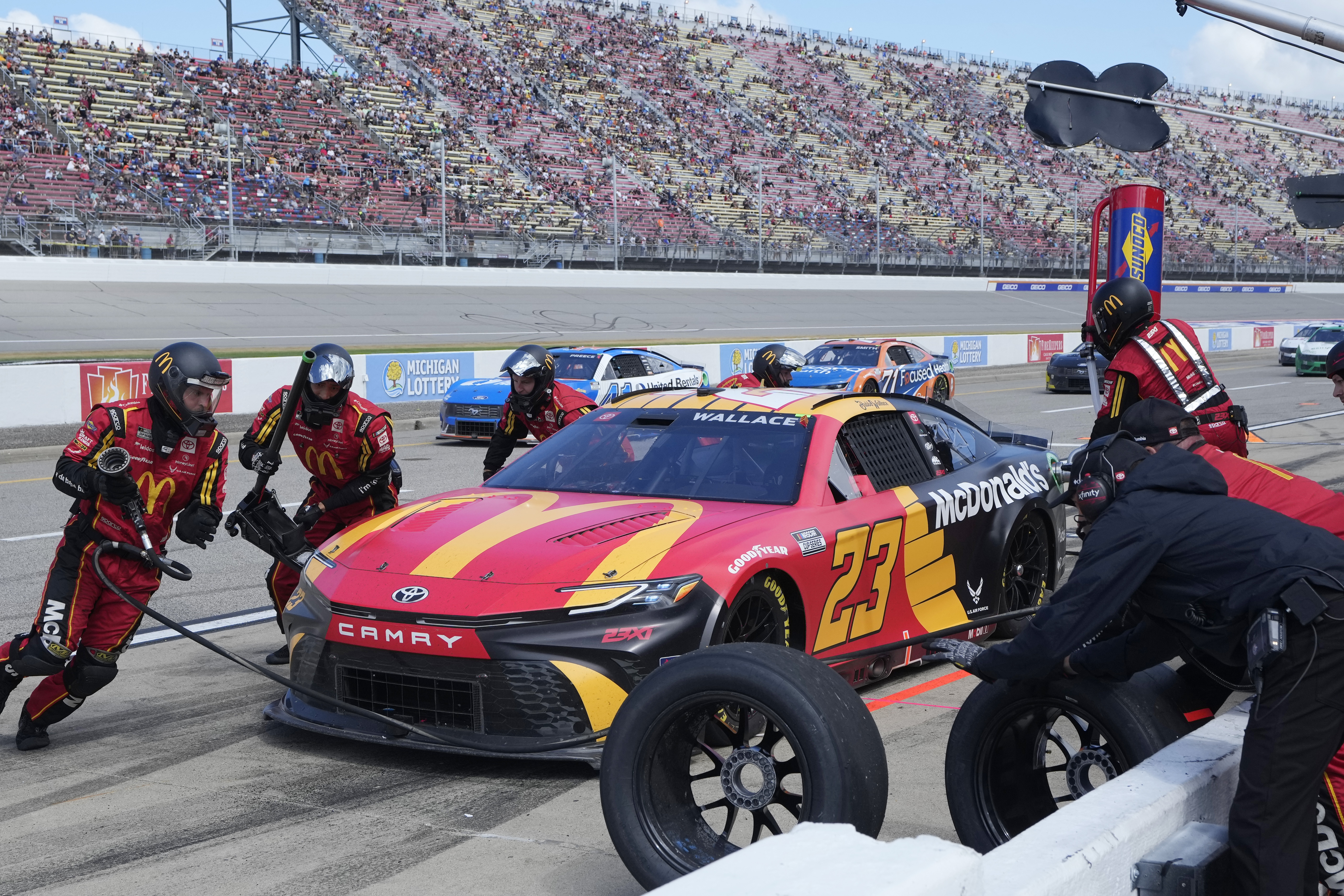 Bubba Wallace makes a pitstop during a NASCAR Cup Series auto race at Michigan International Speedway, Monday, Aug. 19, 2024, in Brooklyn, Mich. 