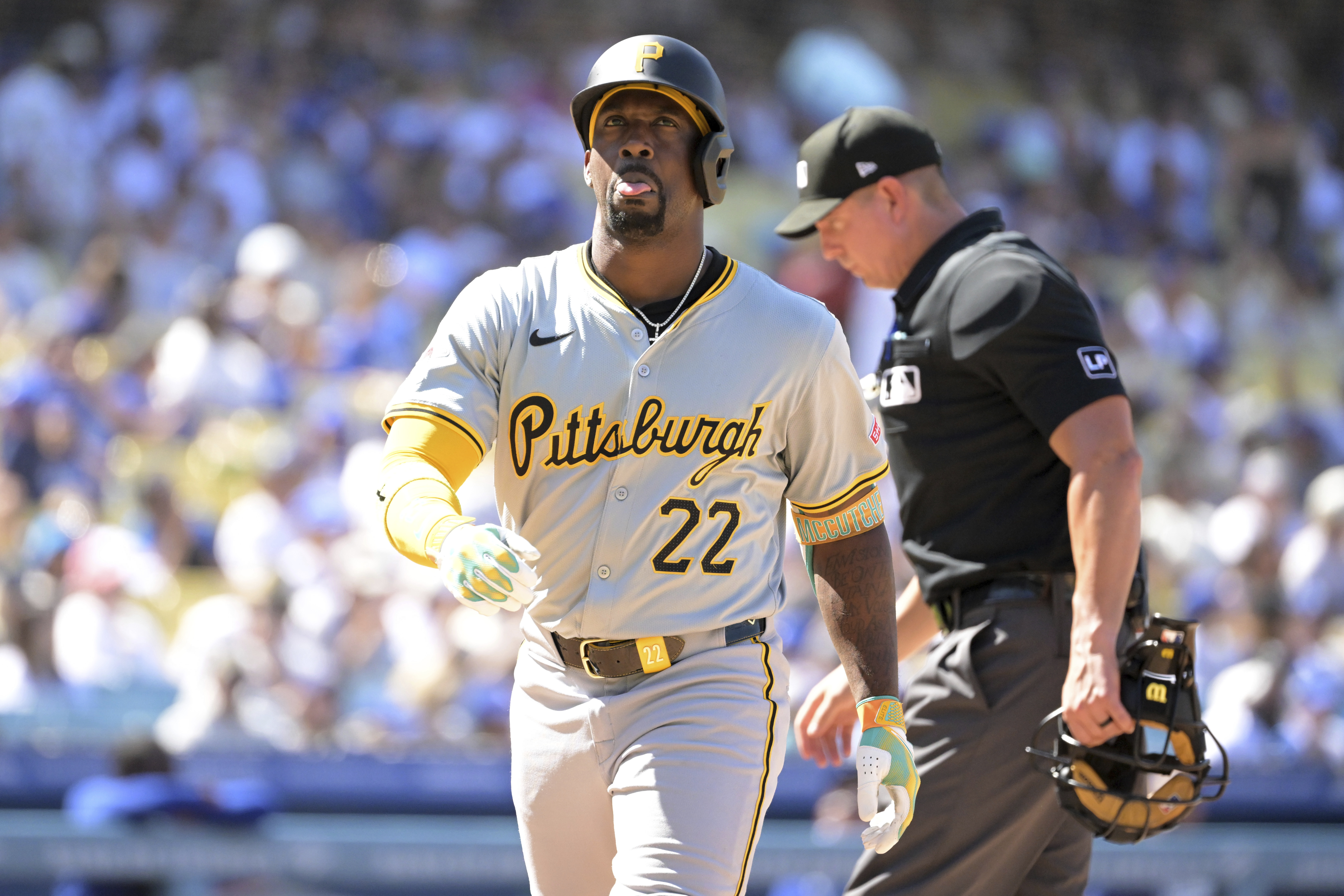Pittsburgh Pirates' Andrew McCutchen crosses the plate after hitting his second two-run home run of the game in the eighth inning during a baseball game against the Los Angeles Dodgers Sunday, Aug. 11, 2024, in Los Angeles. 