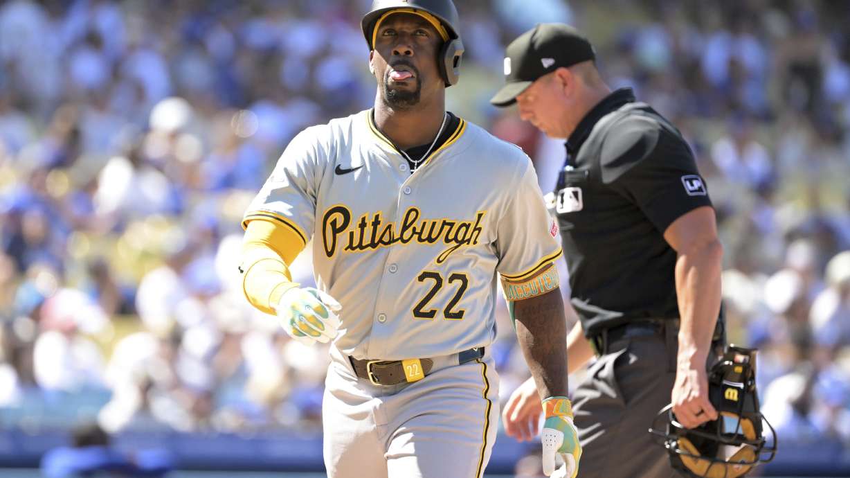 Pittsburgh Pirates' Andrew McCutchen crosses the plate after hitting his second two-run home run of the game in the eighth inning during a baseball game against the Los Angeles Dodgers Sunday, Aug. 11, 2024, in Los Angeles.