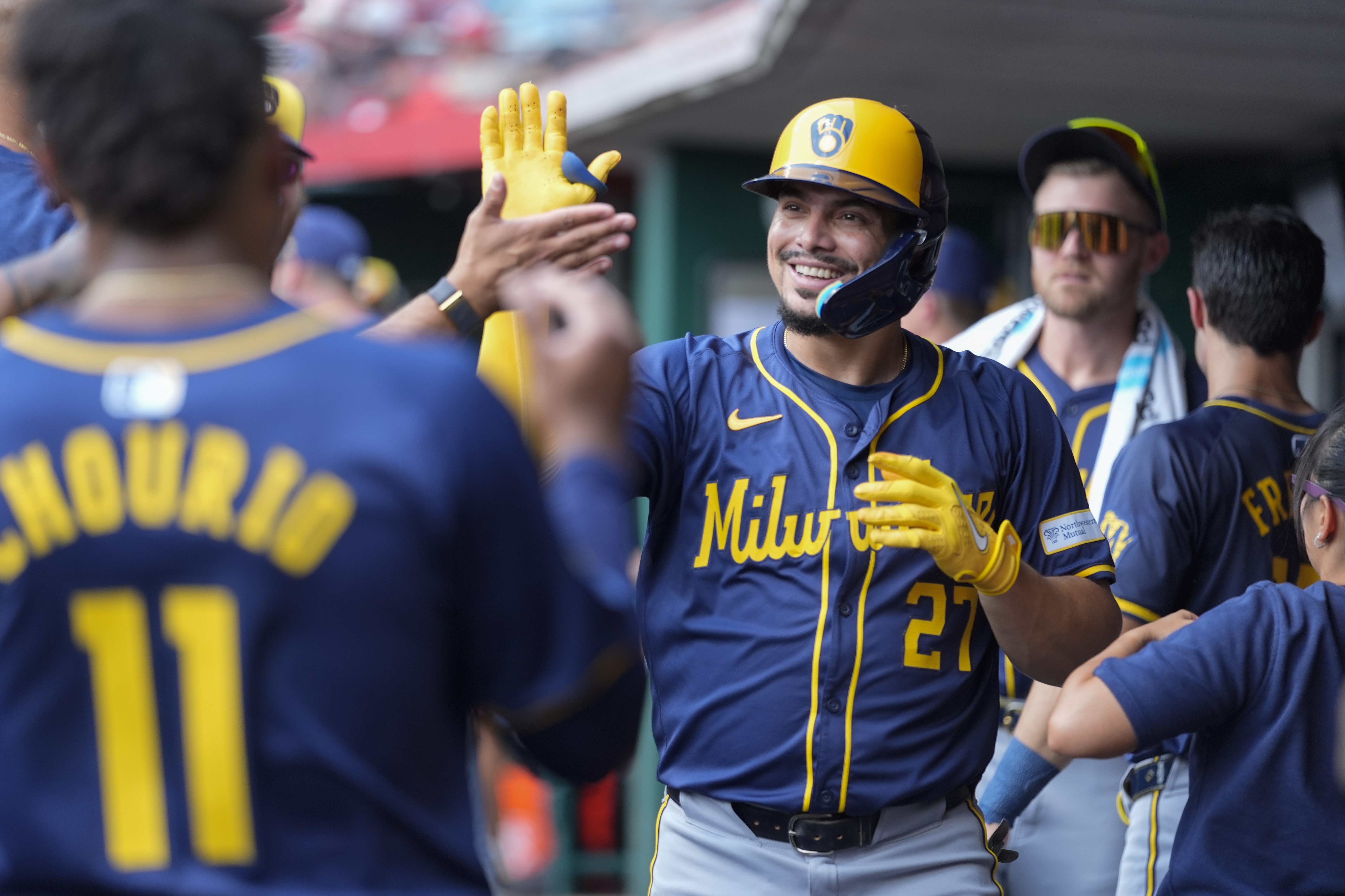 Milwaukee Brewers' Willy Adames (27) celebrates hitting a home run during the second inning of a baseball game against the Cincinnati Reds, Friday, Aug. 30, 2024, in Cincinnati. 
