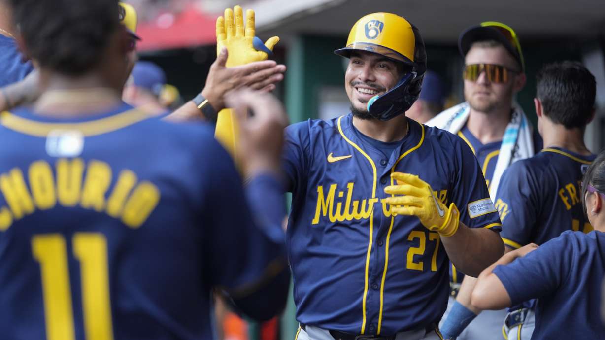 Milwaukee Brewers' Willy Adames (27) celebrates hitting a home run during the second inning of a baseball game against the Cincinnati Reds, Friday, Aug. 30, 2024, in Cincinnati.