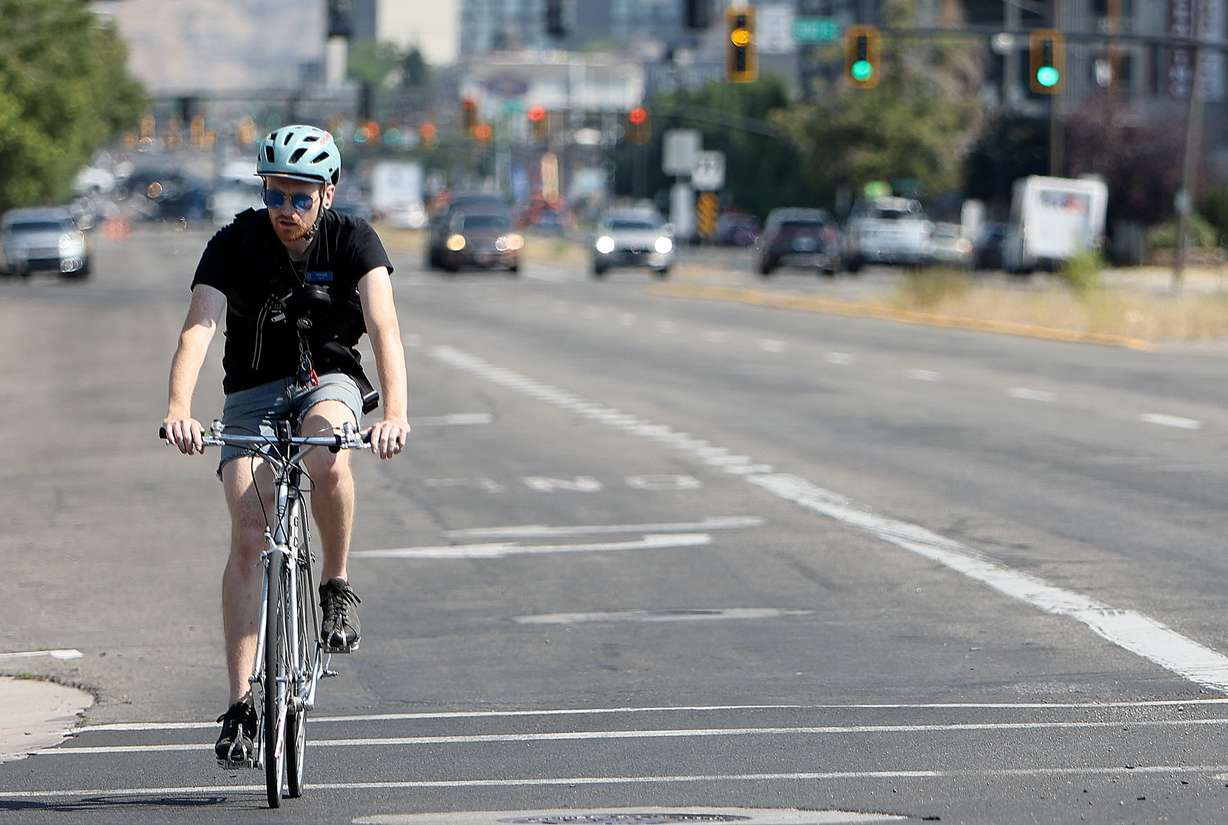 A cyclist rides on 300 West in Salt Lake City on July 17.