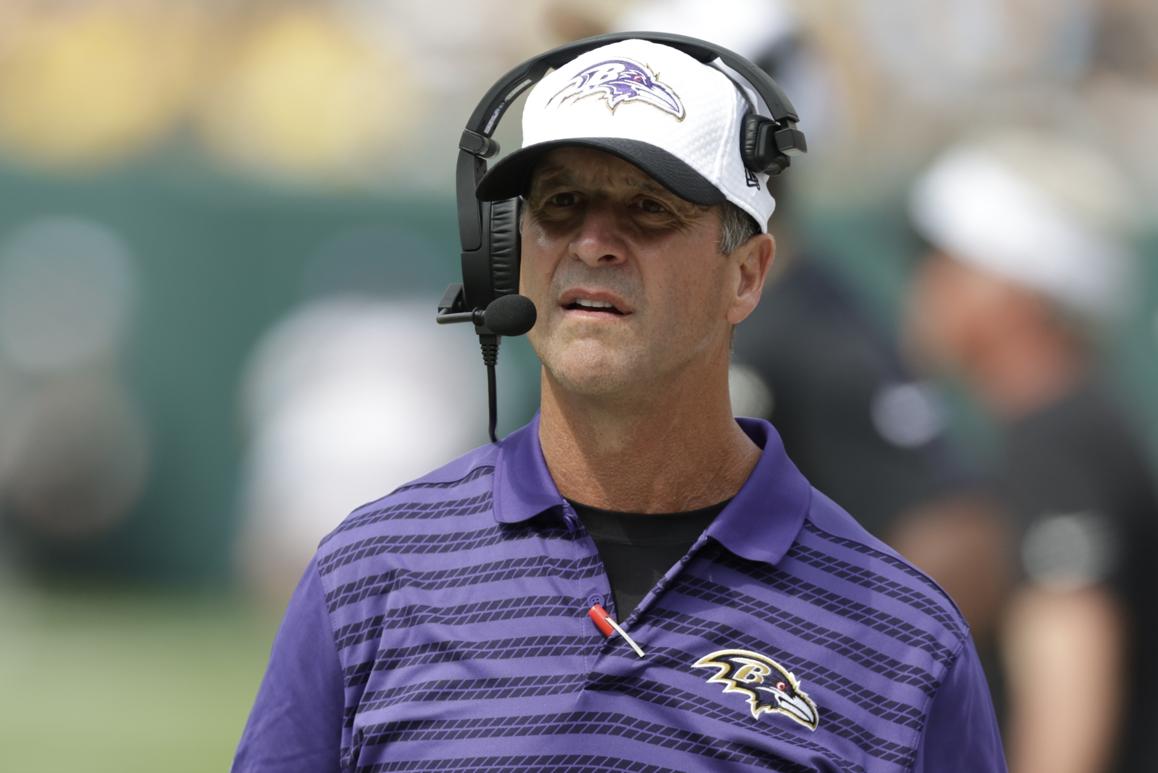 Baltimore Ravens head coach Jiohn Harbaugh watches during the second half of a preseason NFL football game against the Green Bay Packers Saturday, Aug. 24, 2024, in Green Bay, Wis. 