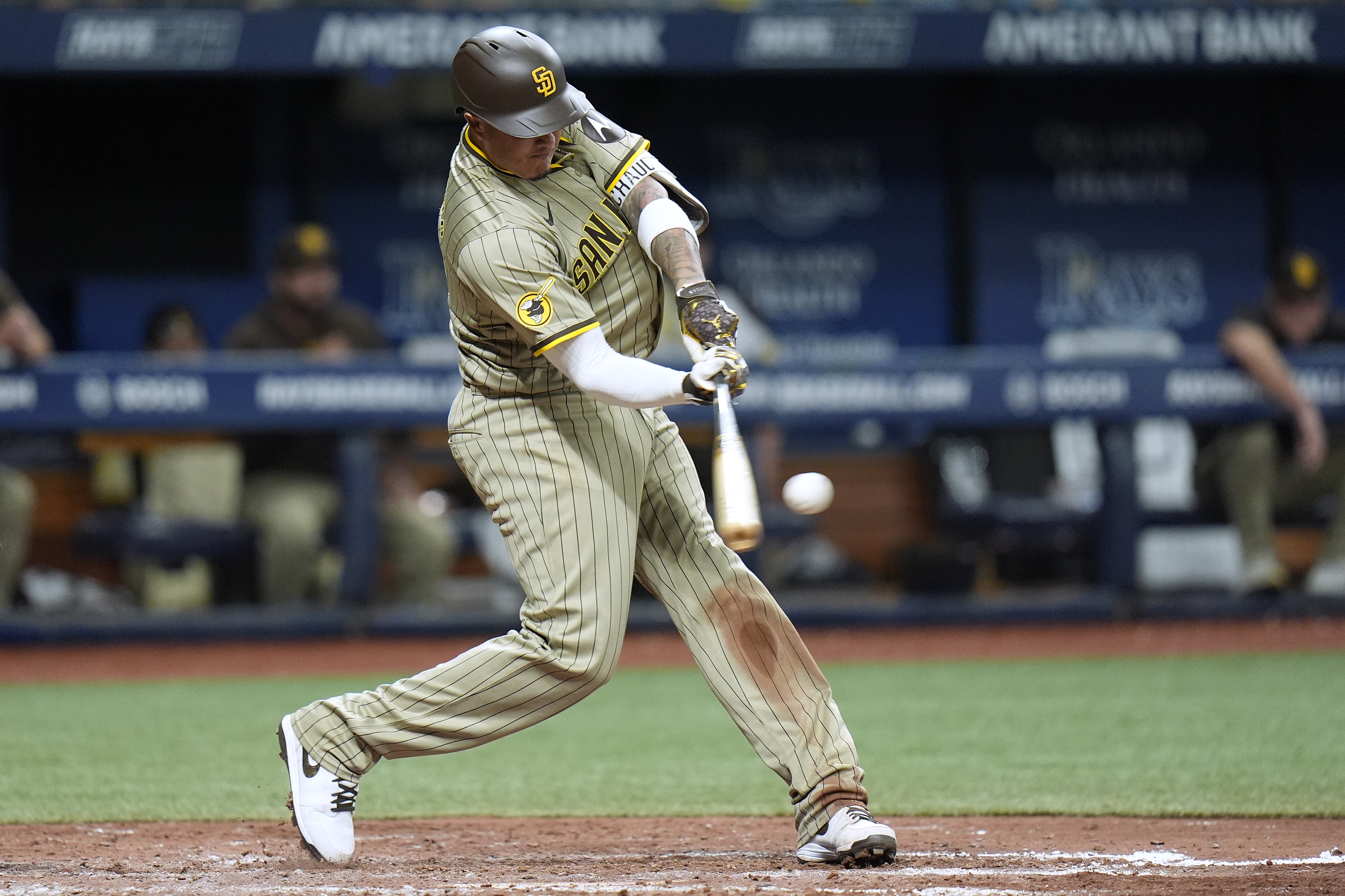 San Diego Padres' Manny Machado lines a single off Tampa Bay Rays relief pitcher Richard Lovelady during the sixth inning of a baseball game Friday, Aug. 30, 2024, in St. Petersburg, Fla. 