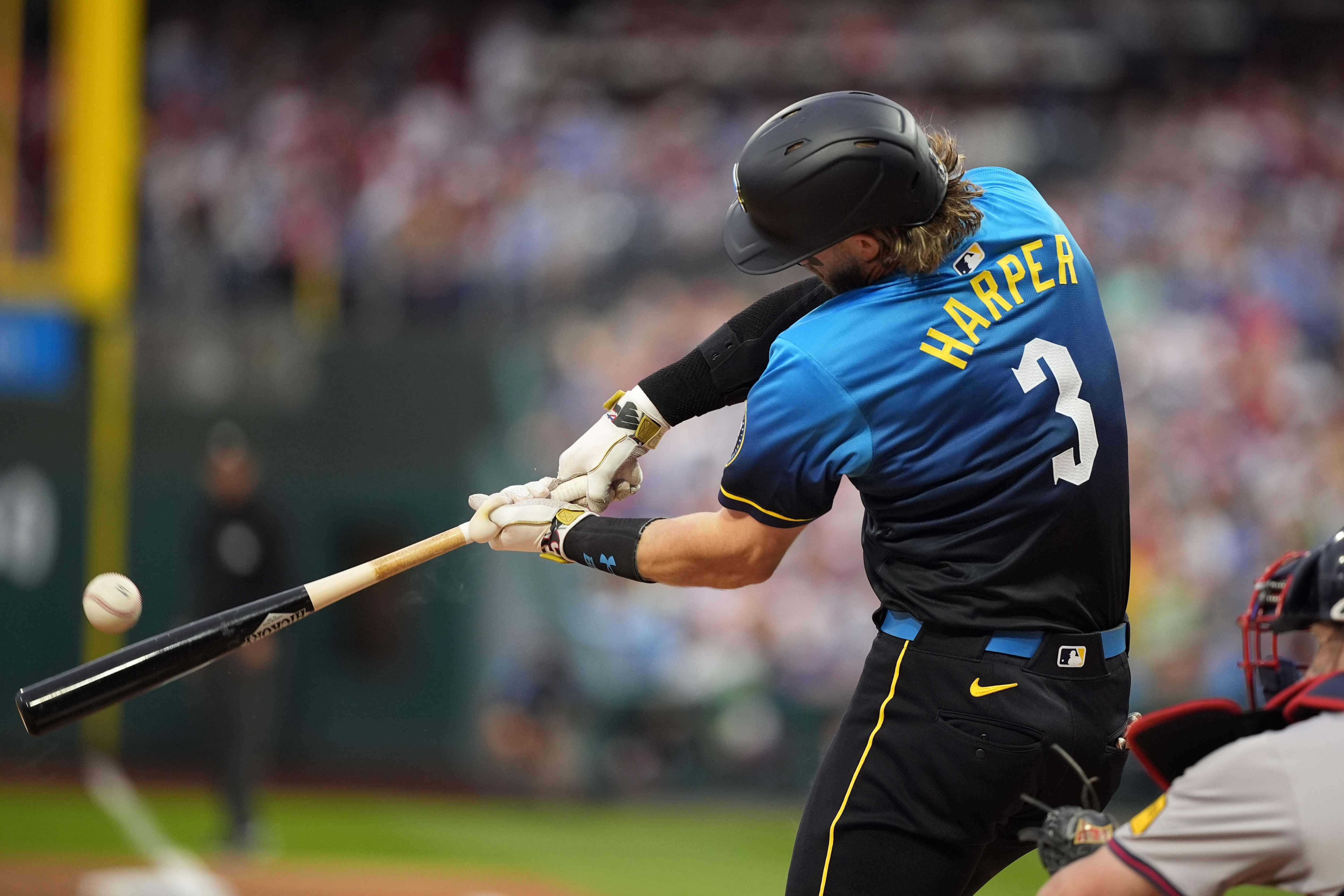 Philadelphia Phillies' Bryce Harper hits a double against Atlanta Braves pitcher Reynaldo López during the first inning of a baseball game, Friday, Aug. 30, 2024, in Philadelphia.
