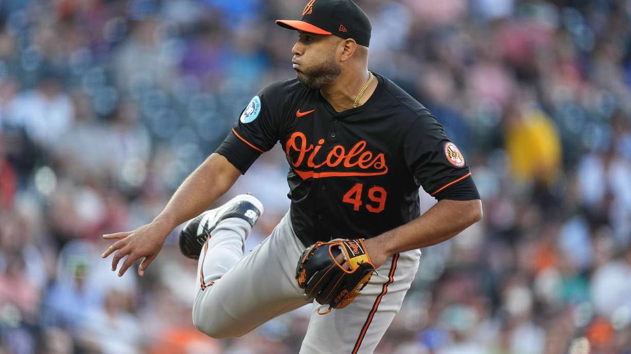 Baltimore Orioles starting pitcher Albert Suárez works against the Colorado Rockies in the first inning of a baseball game Friday, Aug. 30, 2024, in Denver.