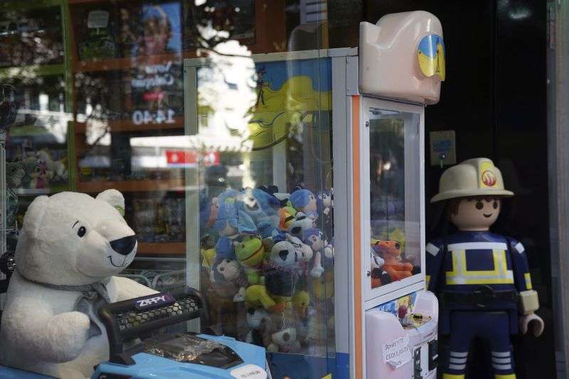 A claw machine stands at a toy store in Rio de Janeiro, Wednesday. The Rio police press office said they were carrying out search warrants targeting claw machines because they are considered games of chance and therefore illegal.