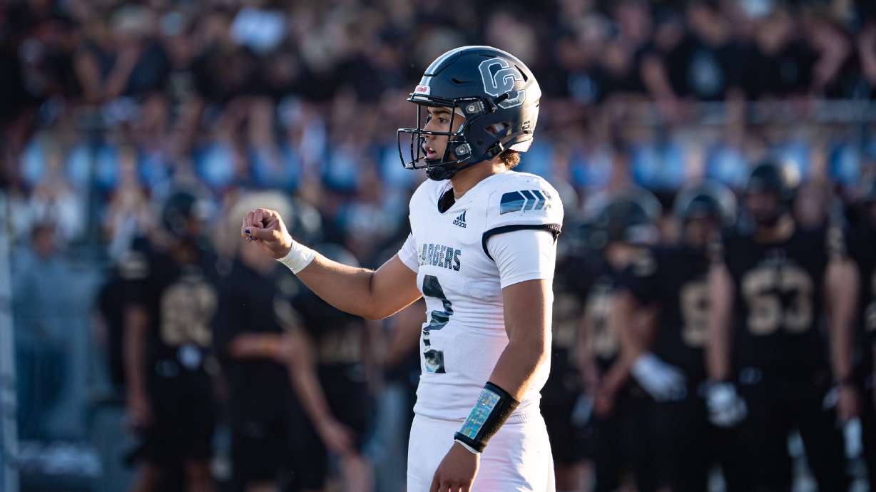Corner Canyon quarterback Helaman Casuga looks to the sidelines during a game against Lone Peak on Aug. 30, 2024.