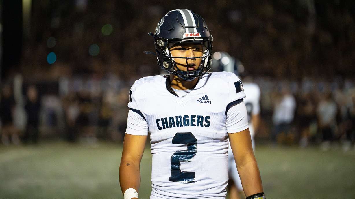 Corner Canyon quarterback Helaman Casuga looks to the sidelines during a game against Lone Peak in Highland on Aug. 30, 2024.