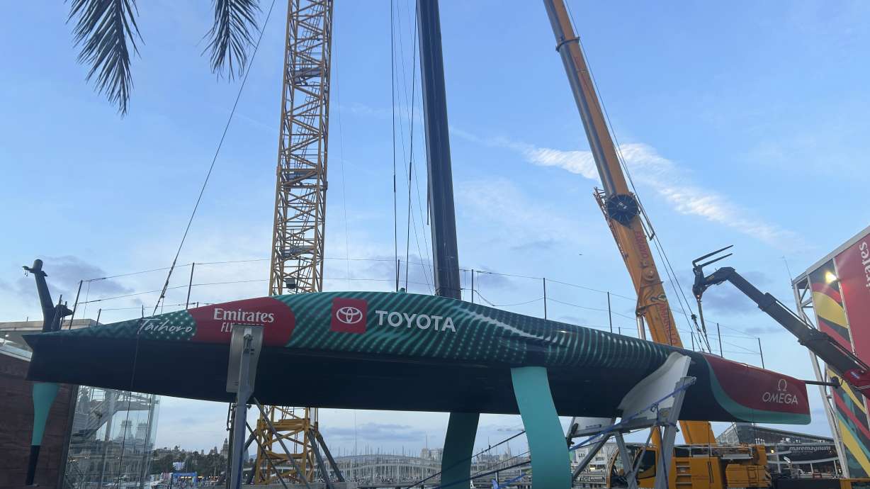 Emirates Team New Zealand’s boat is shown after it was damaged when the crane failed while removing it from the water after racing on the opening day of the 37th America’s Cup in Barcelona, Spain.