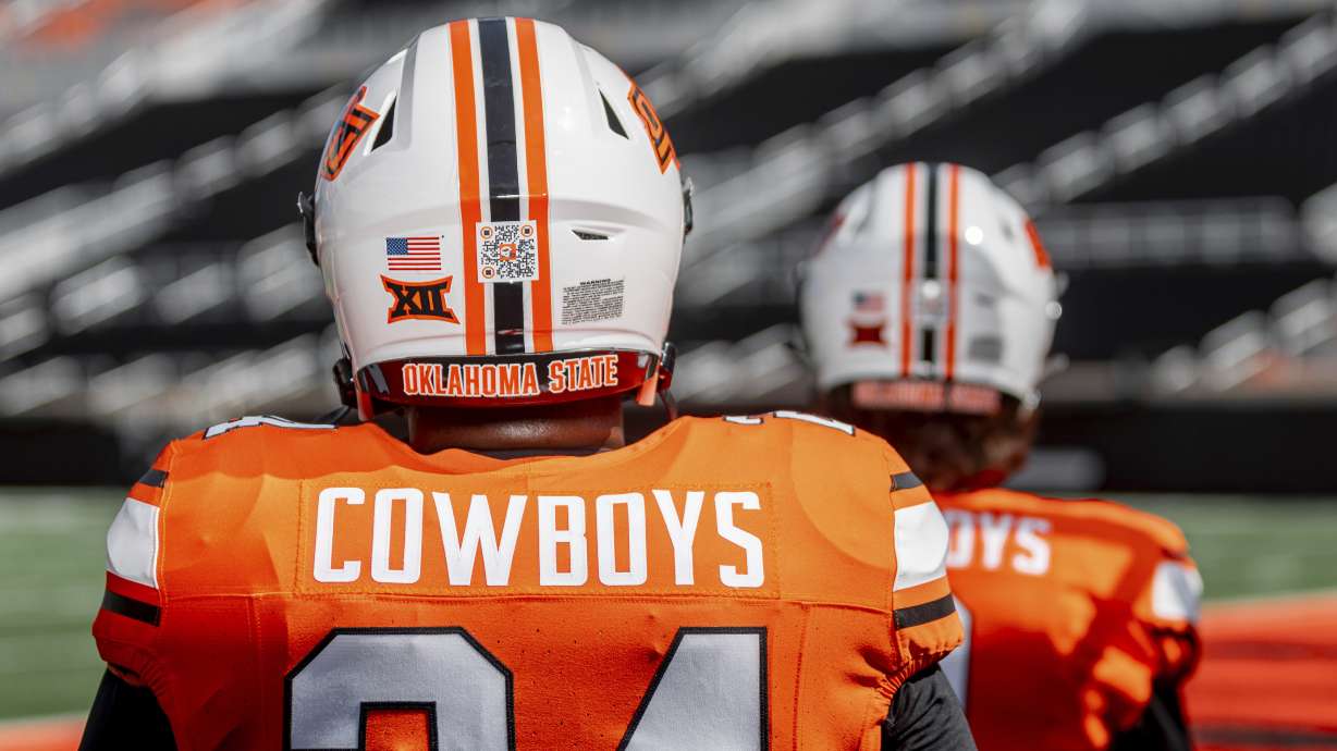This photo provided by Oklahoma State Athletics shows a QR code on an Oklahoma State NCAA college football helmet, Thursday, Aug. 15, 2024, at Boone Pickens Stadium in Stillwater, Okla.