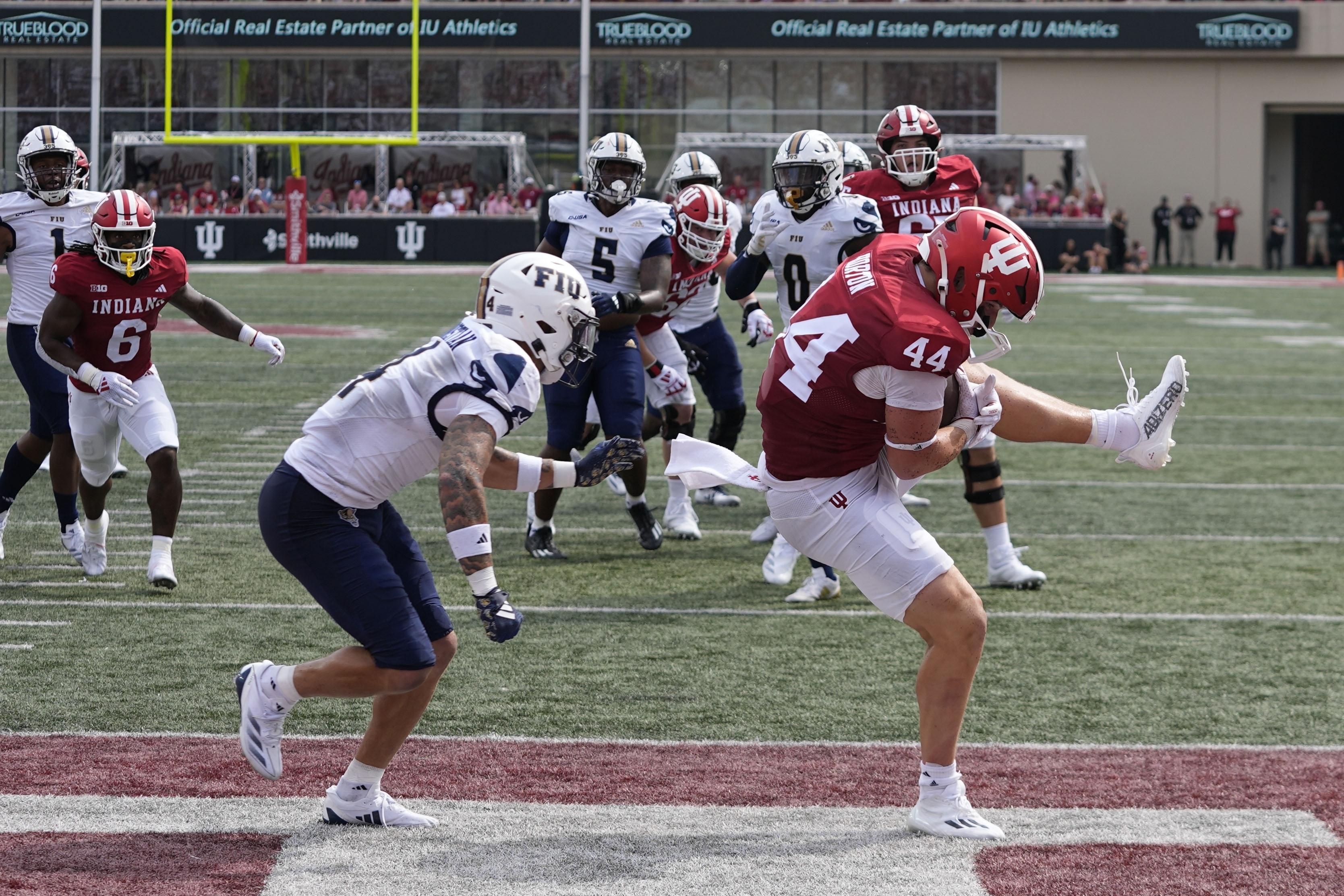 Indiana tight end Zach Horton (44) makes a touchdown catch against Florida International defensive back CJ Christian (4) during the first half of an NCAA college football game Saturday, Aug. 31, 2024, in Bloomington, Ind. 