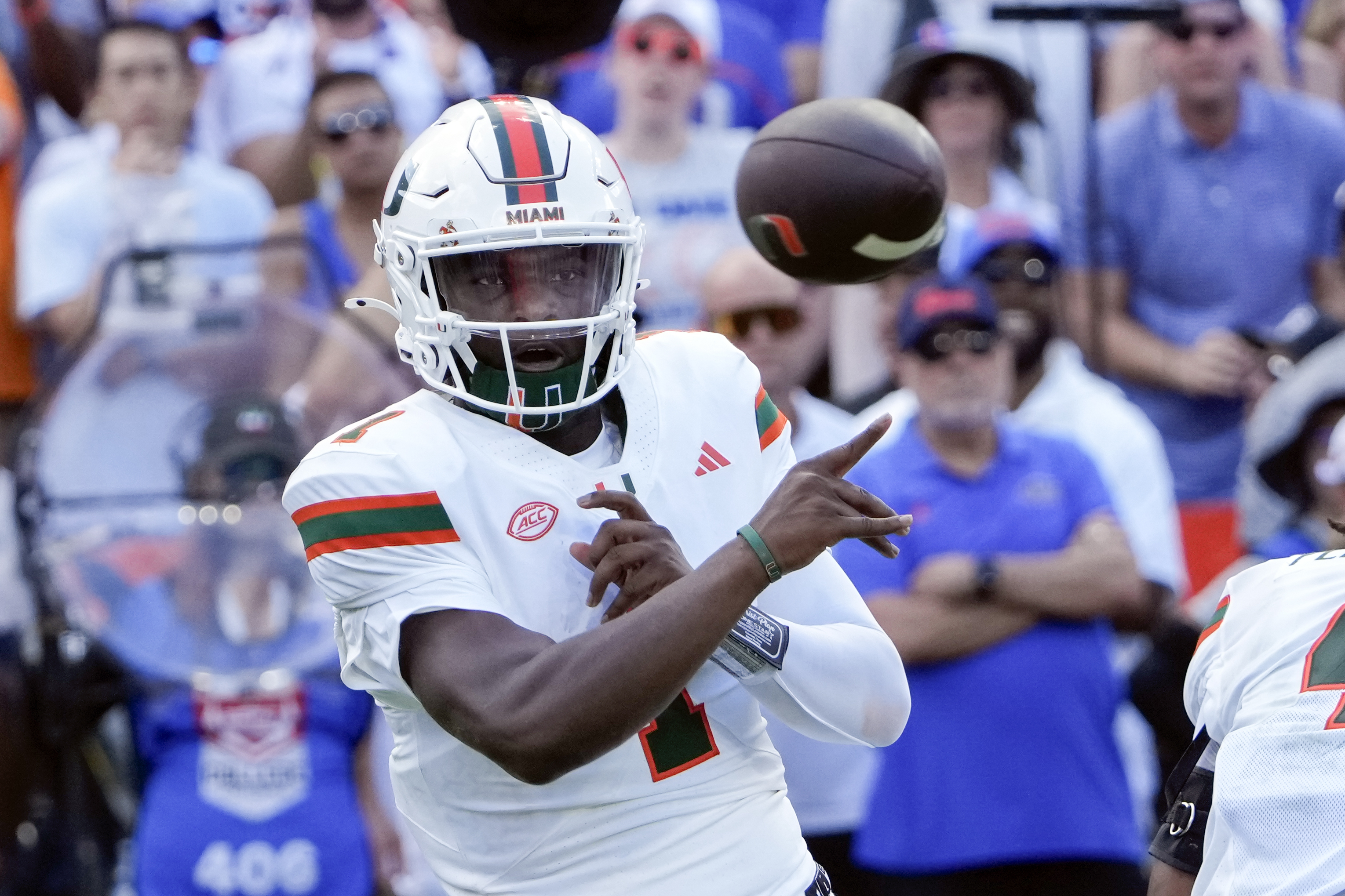 Miami quarterback Cam Ward throws a pass during the first half of an NCAA college football game against Florida, Saturday, Aug. 31, 2024, in Gainesville, Fla. 