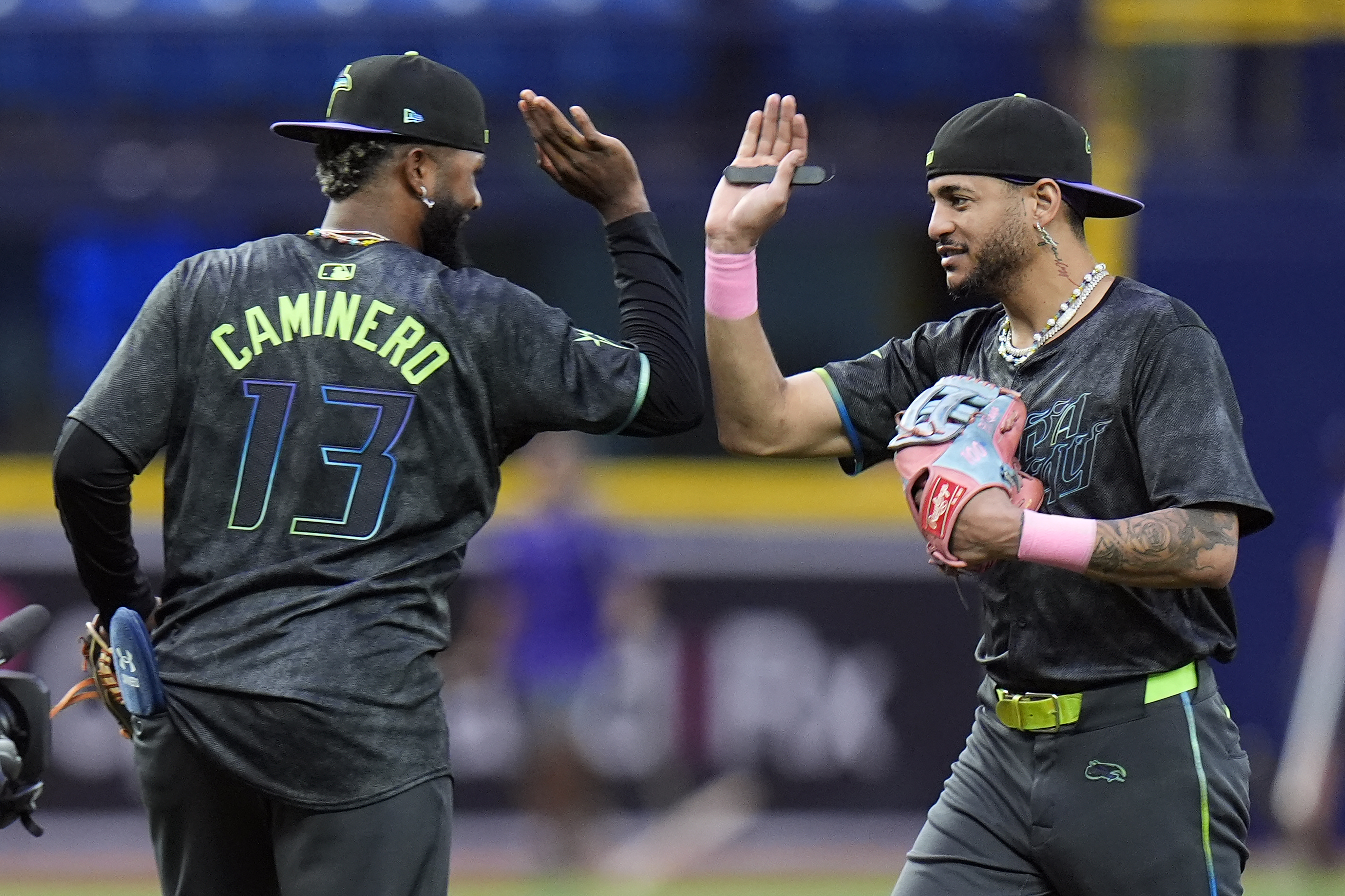 Tampa Bay Rays' Jose Siri celebrates with Junior Caminero (13) after the team defeated the San Diego Padres during a baseball game Saturday, Aug. 31, 2024, in St. Petersburg, Fla. 
