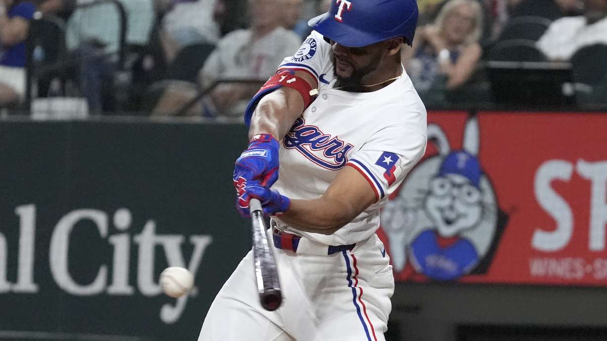 Texas Rangers' Leody Taveras hits a bases loaded single scoring teammate Ezequiel Duran ending the ninth inning to win a baseball game against the Oakland Athletics, Saturday, Aug. 31, 2024, in Arlington, Texas.
