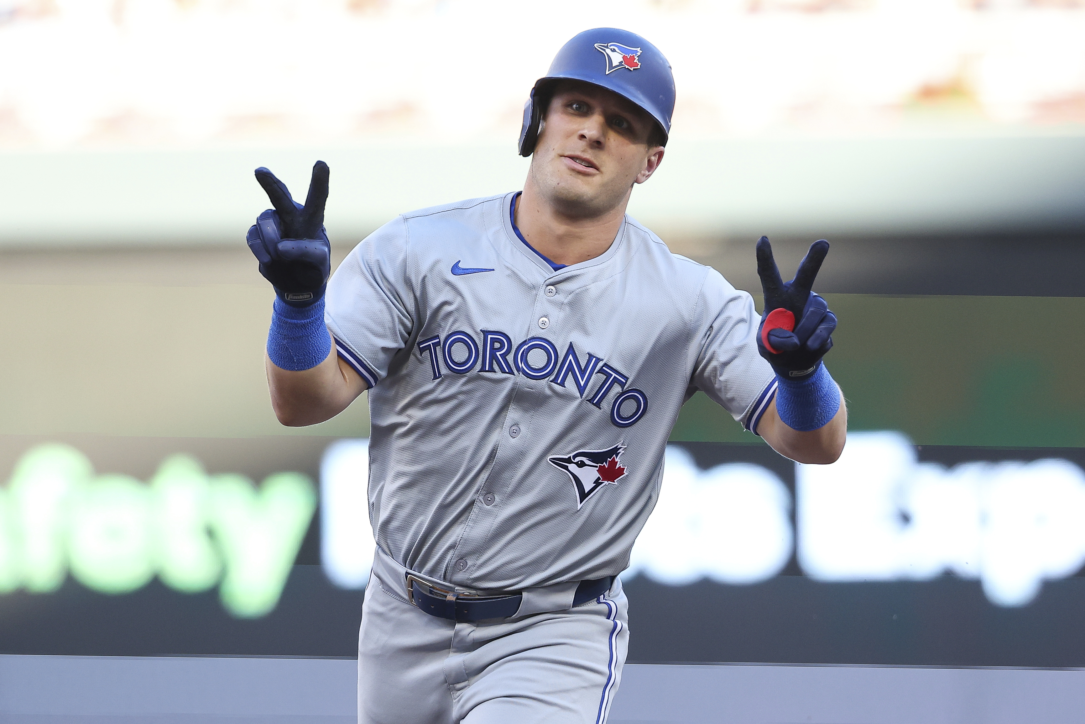 Toronto Blue Jays' Daulton Varsho celebrates his two-run home run while he runs the bases during the first inning of a baseball game against the Minnesota Twins, Saturday, Aug. 31, 2024, in Minneapolis. 