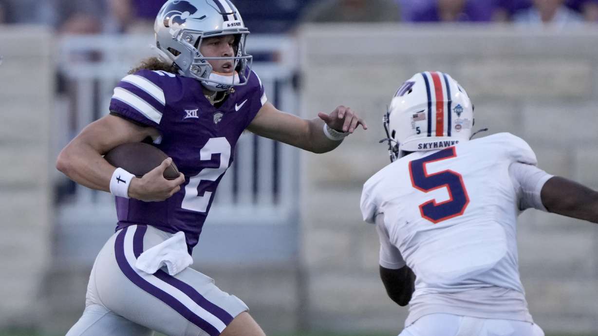 Kansas State quarterback Avery Johnson (2) runs past UT Martin linebacker Michael Pleas Jr. (2) during the first half of an NCAA college football game Saturday, Aug. 31, 2024, in Manhattan, Kan.