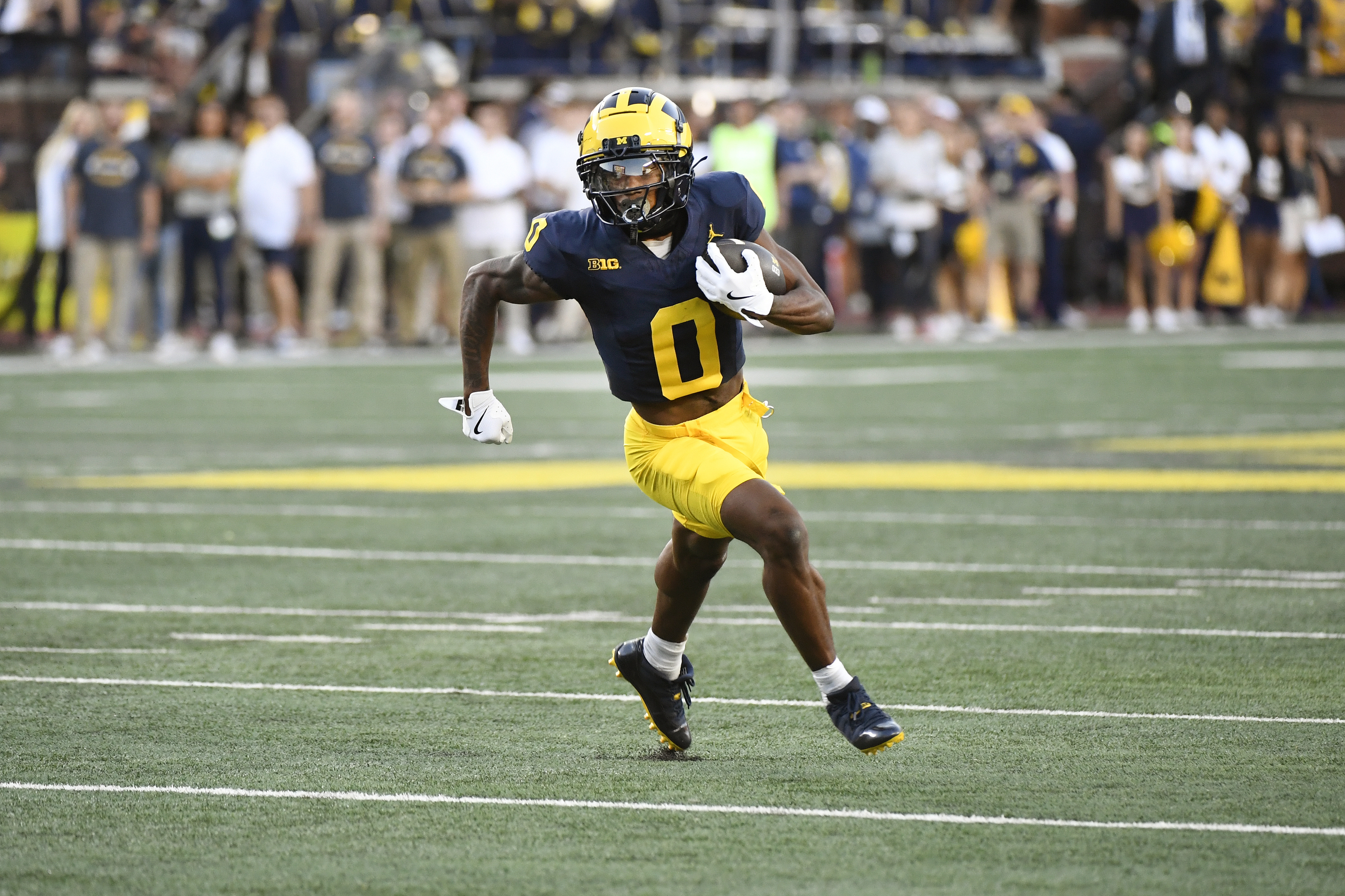 Michigan wide receiver Semaj Morgan runs with the ball against Fresno State in the first half of an NCAA college football game, Saturday, Aug. 31, 2024, in Ann Arbor, Mich. 