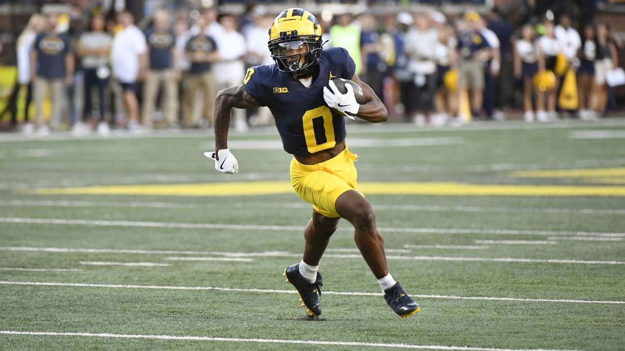 Michigan wide receiver Semaj Morgan runs with the ball against Fresno State in the first half of an NCAA college football game, Saturday, Aug. 31, 2024, in Ann Arbor, Mich.