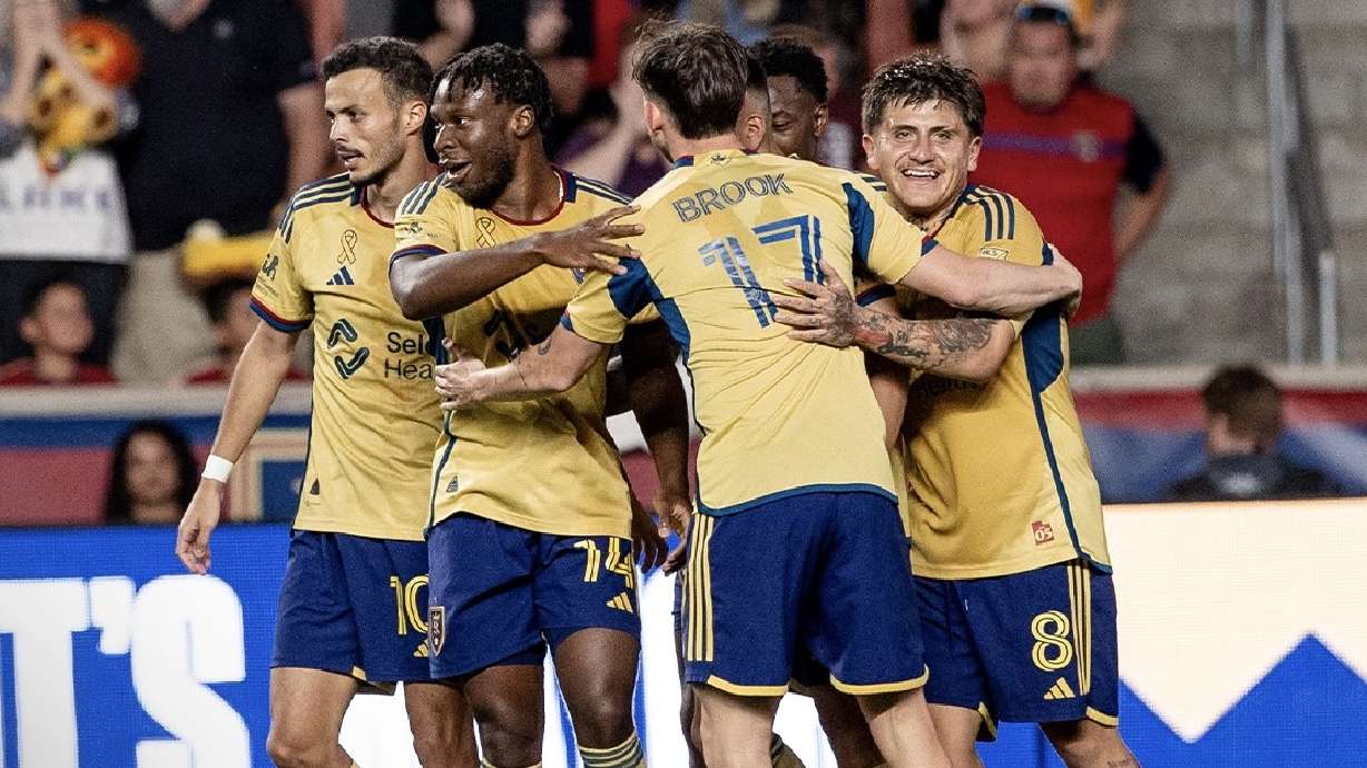 Real Salt Lake celebrates a goal against the New England Revolution at America First Field.