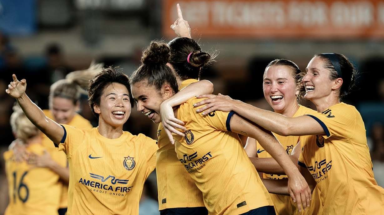 The Utah Royals celebrate a goal against Houston.