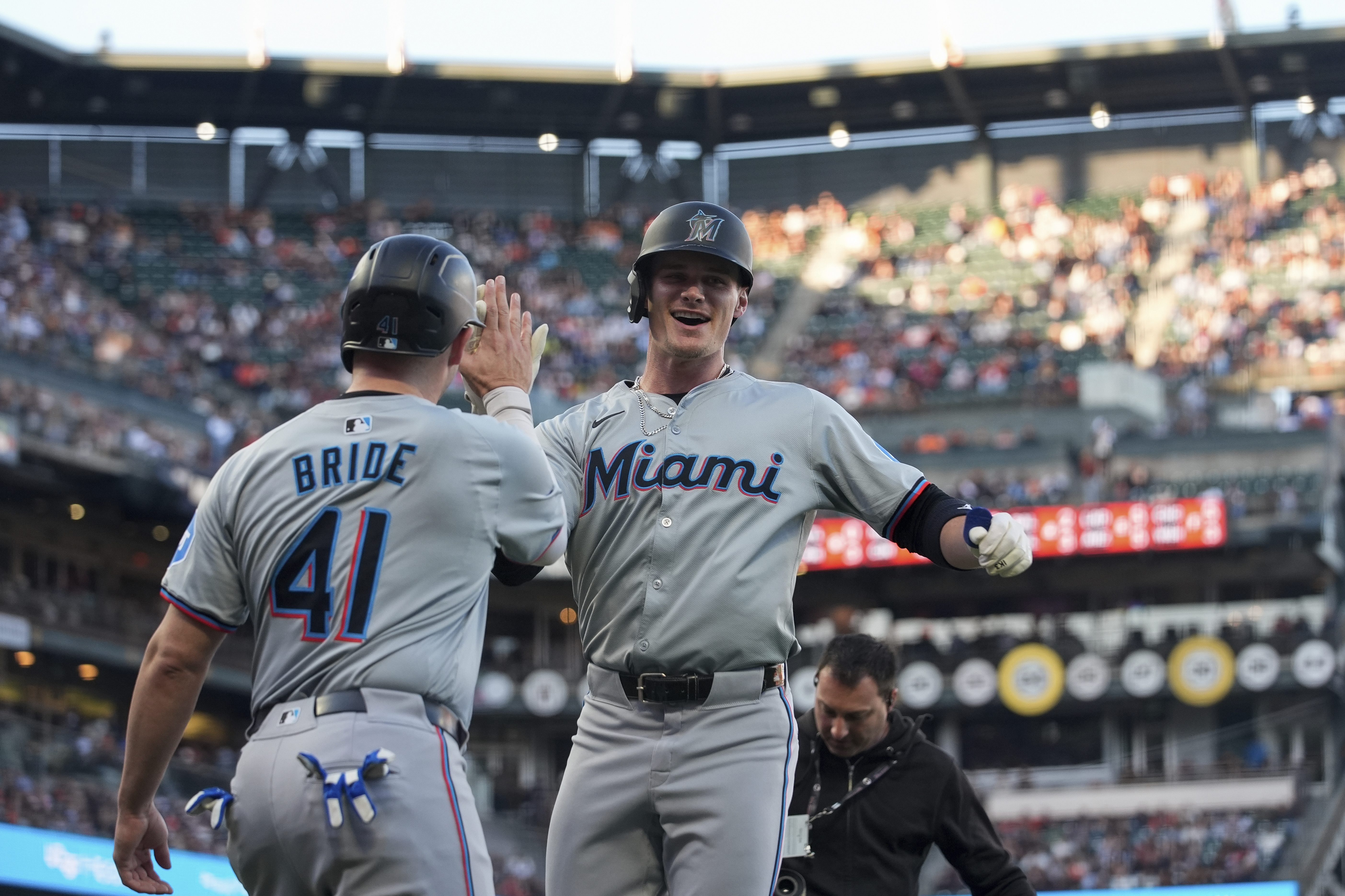 Miami Marlins' Griffin Conine, right, celebrates with Jonah Bride after hitting a two-run home run during the second inning of a baseball game against the San Francisco Giants, Saturday, Aug. 31, 2024, in San Francisco. 