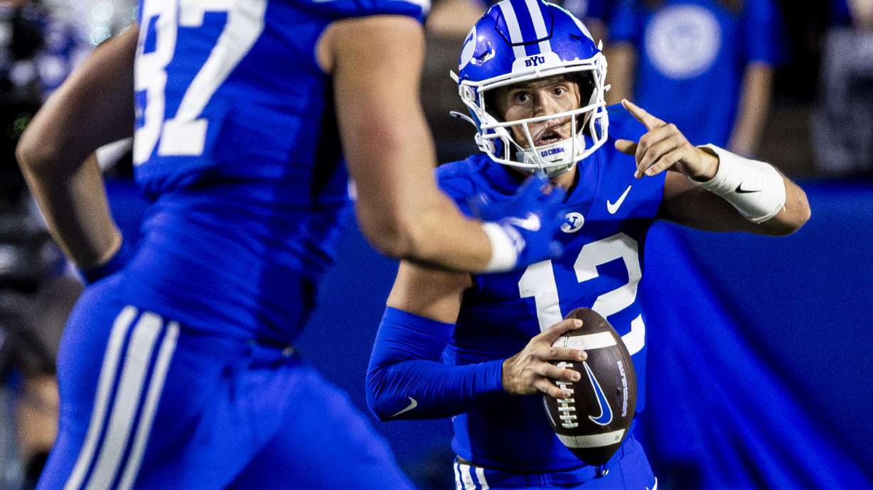 Brigham Young quarterback Jake Retzlaff (12) looks to pass during BYU’s home opener against Southern Illinois University held at LaVell Edwards Stadium in Provo on Saturday, Aug. 31, 2024.