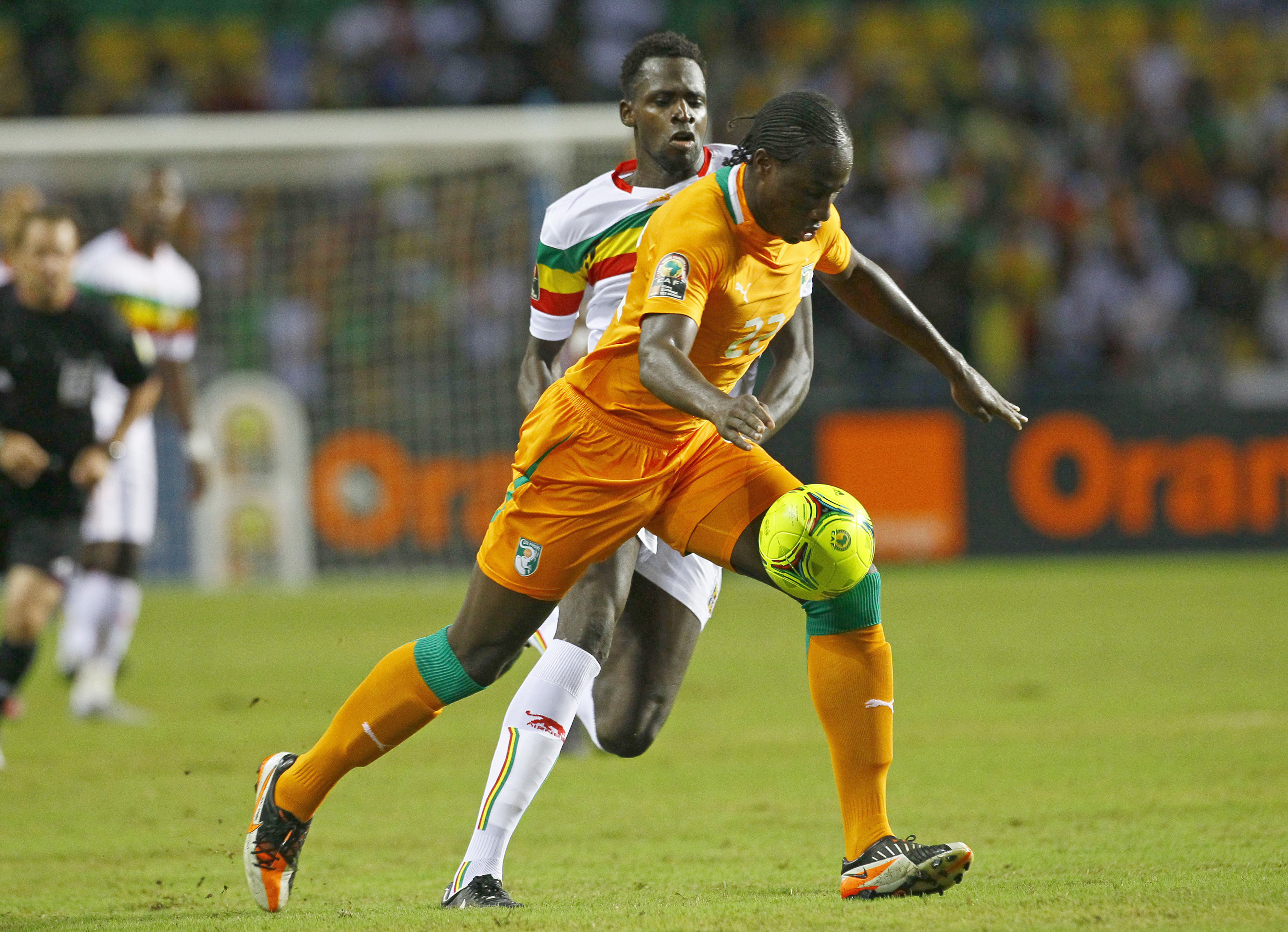 FILE - Ivory Coast's Souleymane Bamba, front, is challenged by Mali's Tidiane Cheick Diabate during their African Cup of Nations semi final soccer match at Stade de L'Amitie in Libreville, Gabon, Wednesday, Feb. 8, 2012. 