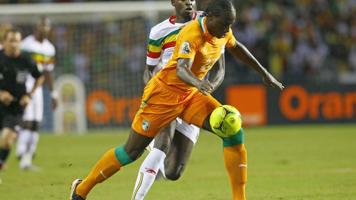 FILE - Ivory Coast's Souleymane Bamba, front, is challenged by Mali's Tidiane Cheick Diabate during their African Cup of Nations semi final soccer match at Stade de L'Amitie in Libreville, Gabon, Wednesday, Feb. 8, 2012.