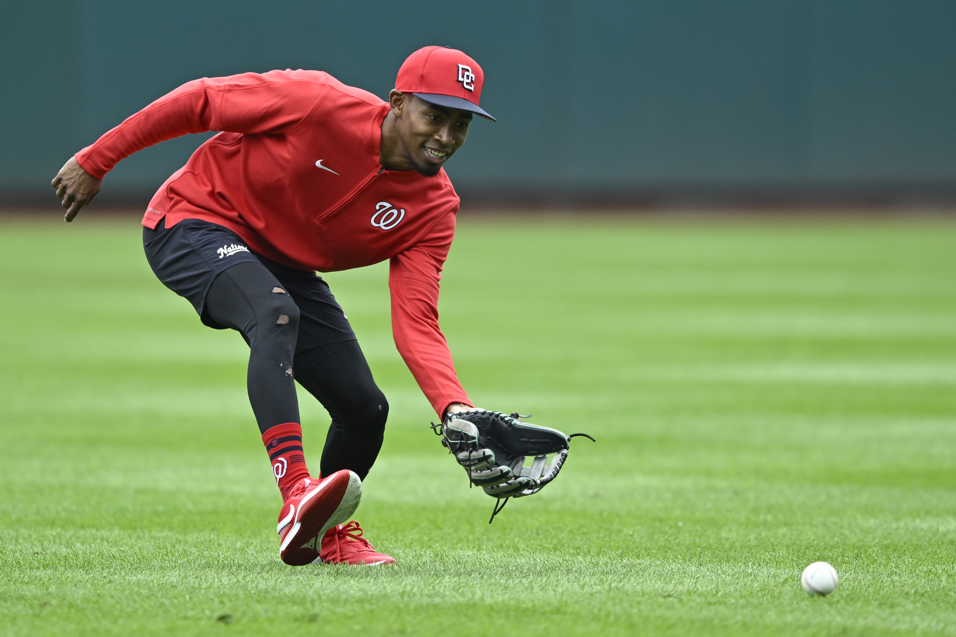 Washington Nationals' Darren Baker fields a grounder during outfield practice after being called up from the minor leagues before a baseball game against the Chicago Cubs, Sunday, Sept. 1, 2024, in Washington. 