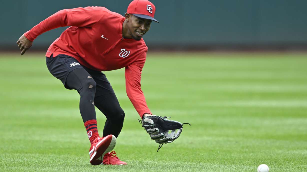 Washington Nationals' Darren Baker fields a grounder during outfield practice after being called up from the minor leagues before a baseball game against the Chicago Cubs, Sunday, Sept. 1, 2024, in Washington.