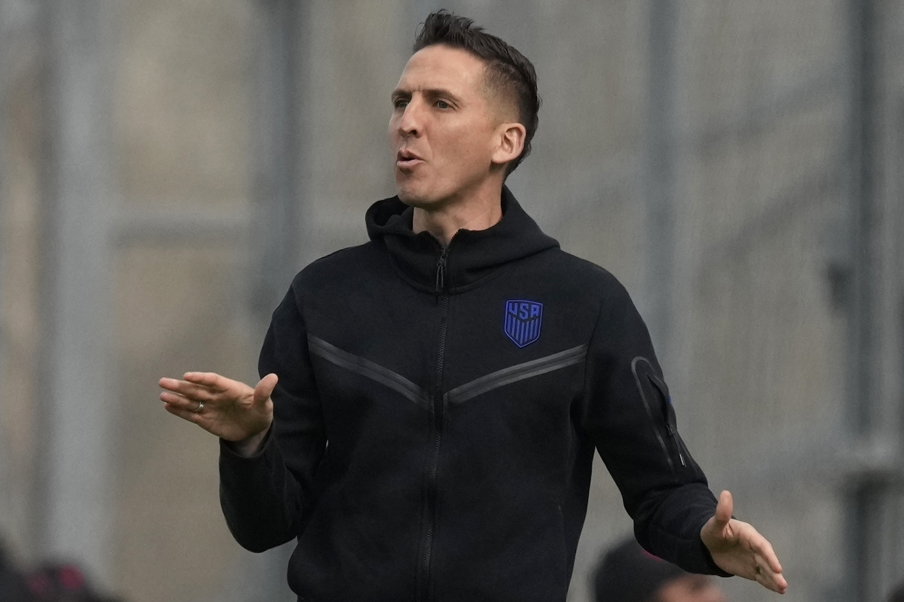 Coach Mikey Varas of the United States, gives directions to his players during a FIFA U-20 World Cup Group B soccer match against Slovakia at the Bicentenario stadium in San Juan, Argentina, Friday, May 26, 2023.