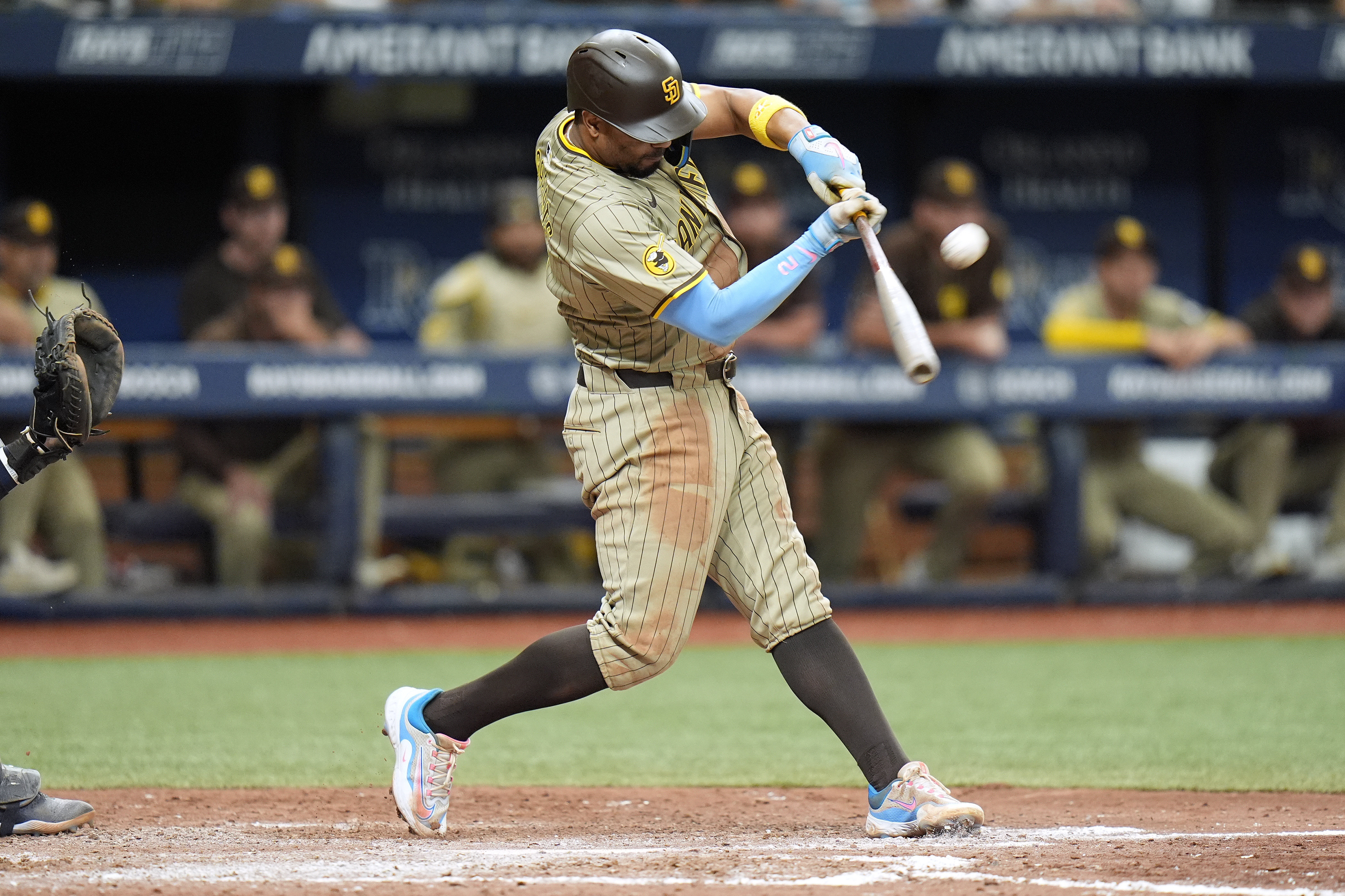 San Diego Padres' Xander Bogaerts hits a run scoring sacrifice fly off Tampa Bay Rays relief pitcher Manuel Rodriguez during the ninth inning of a baseball game Sunday, Sept. 1, 2024, in St. Petersburg, Fla. 