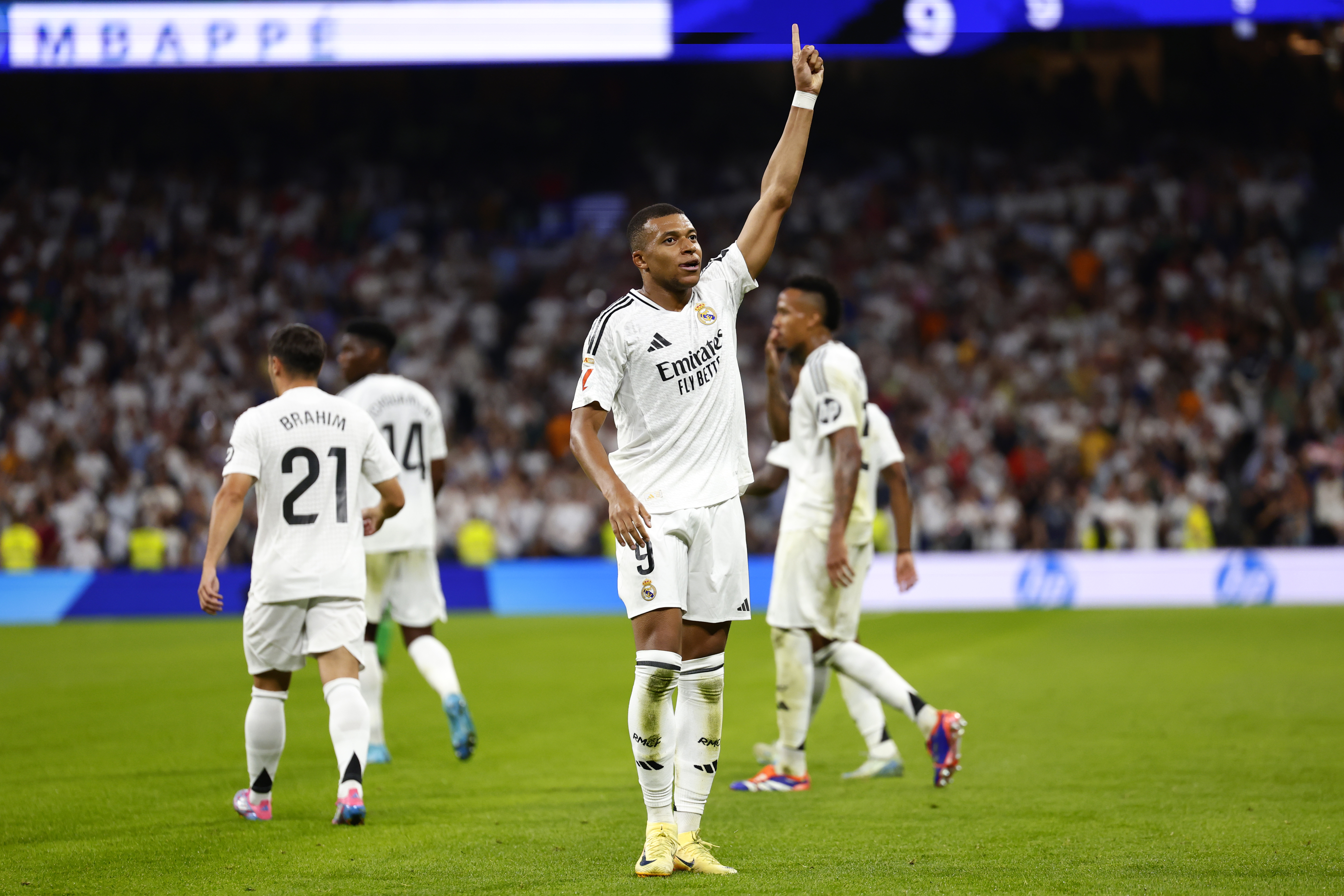 Real Madrid's Kylian Mbappe celebrates after scoring his sides first goal during the Spanish La Liga soccer match between Real Madrid and Betis at the Santiago Bernabeu stadium in Madrid, Spain, Sunday, Sept. 1, 2024.