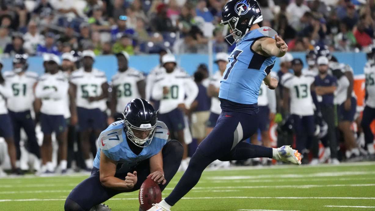 Tennessee Titans kicker Brayden Narveson, right, kicks a 21-yard field goal during the second half of an NFL preseason football game against the Seattle Seahawks, Saturday, Aug. 17, 2024, in Nashville, Tenn.