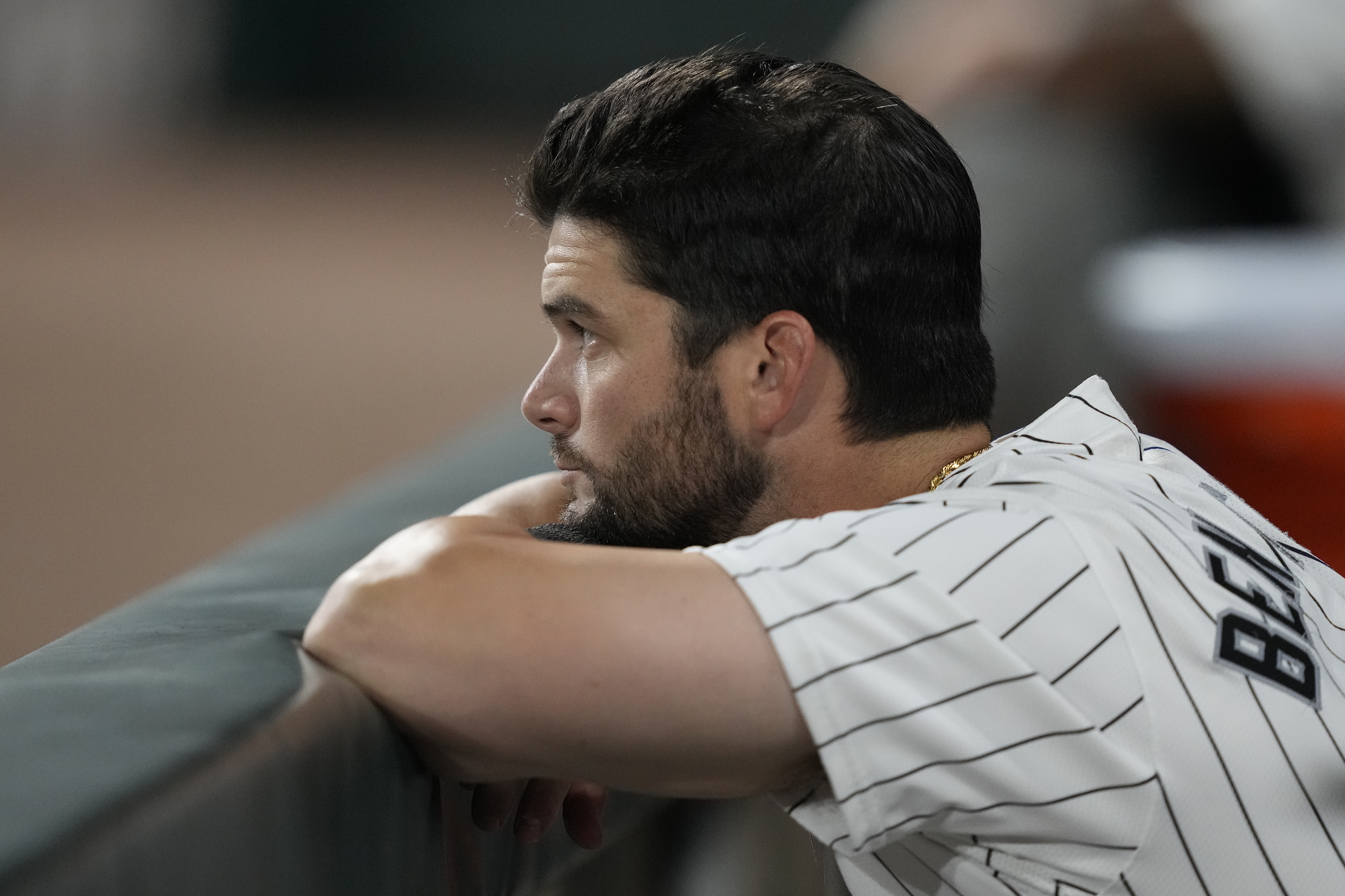 Chicago White Sox's Andrew Benintendi looks out from the dugout during the ninth inning of a baseball game against the New York Mets on Saturday, Aug. 31, 2024, that saw the team tie the franchise season record of 106 losses in Chicago.