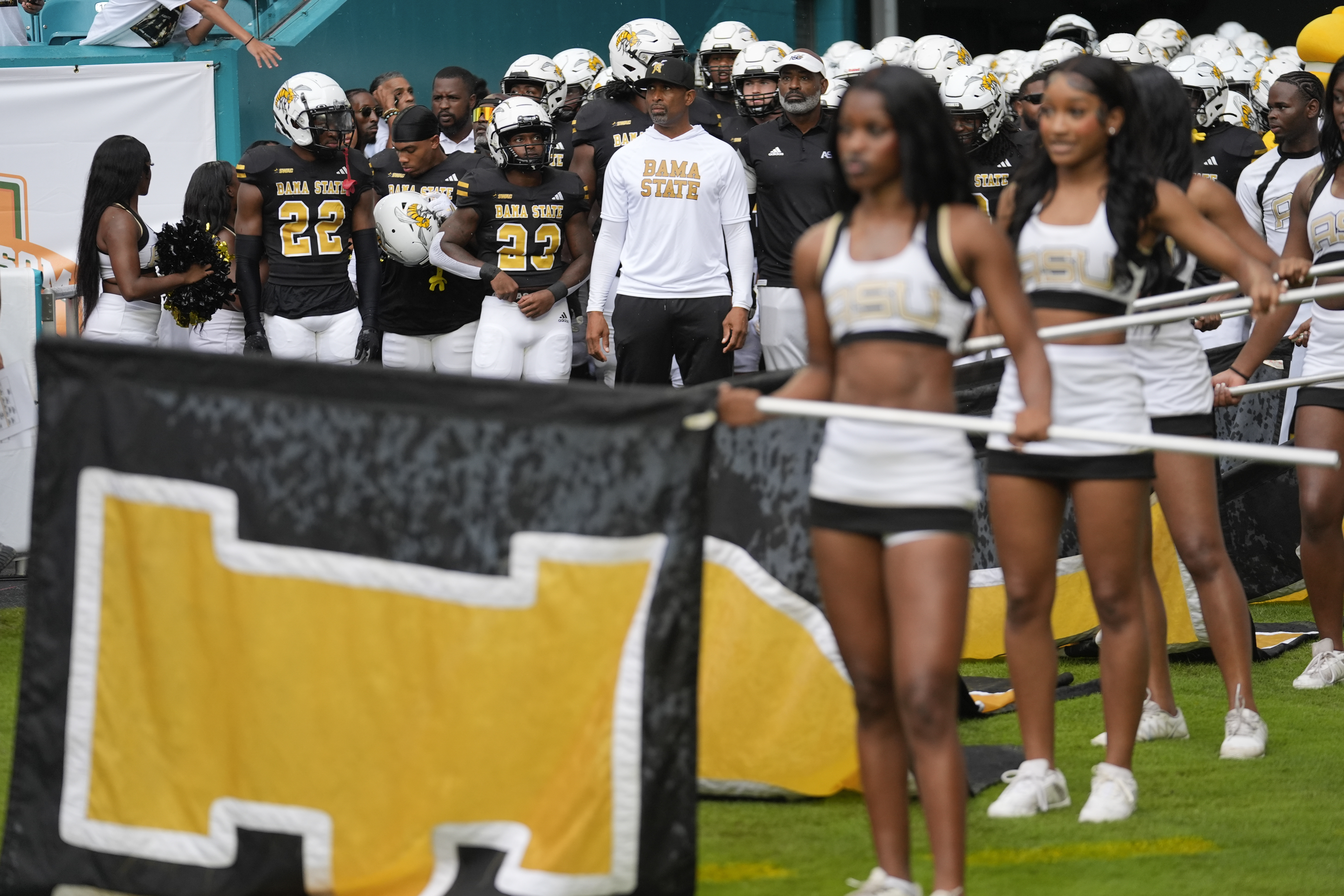 Alabama State head coach Eddie Robinson Jr., center, waits with his players to take the field for of the Orange Blossom Classic NCAA college football game between NC Central and Alabama State, Sunday, Sept. 1, 2024, in Miami Gardens, Fla. 