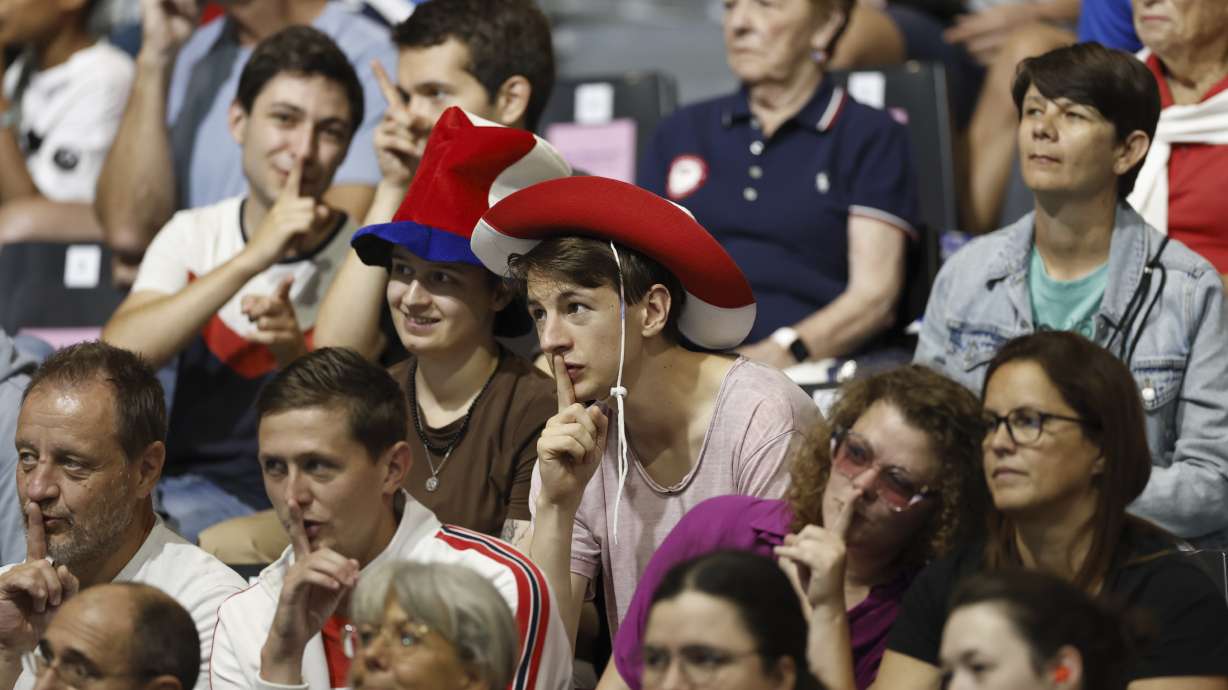 A group of fans shush the crowd as the "Shh Cam" scans the audience during the mens' United States versus France goalball game during the Paralympic Games in Paris on Saturday, Aug. 31, 2024. Football fans are known for being loud and rowdy. But the Paralympic sports most closely related to football, blind football and goalball, require spectators to be silent during game action so that players can receive audible cues from the ball and the environment.