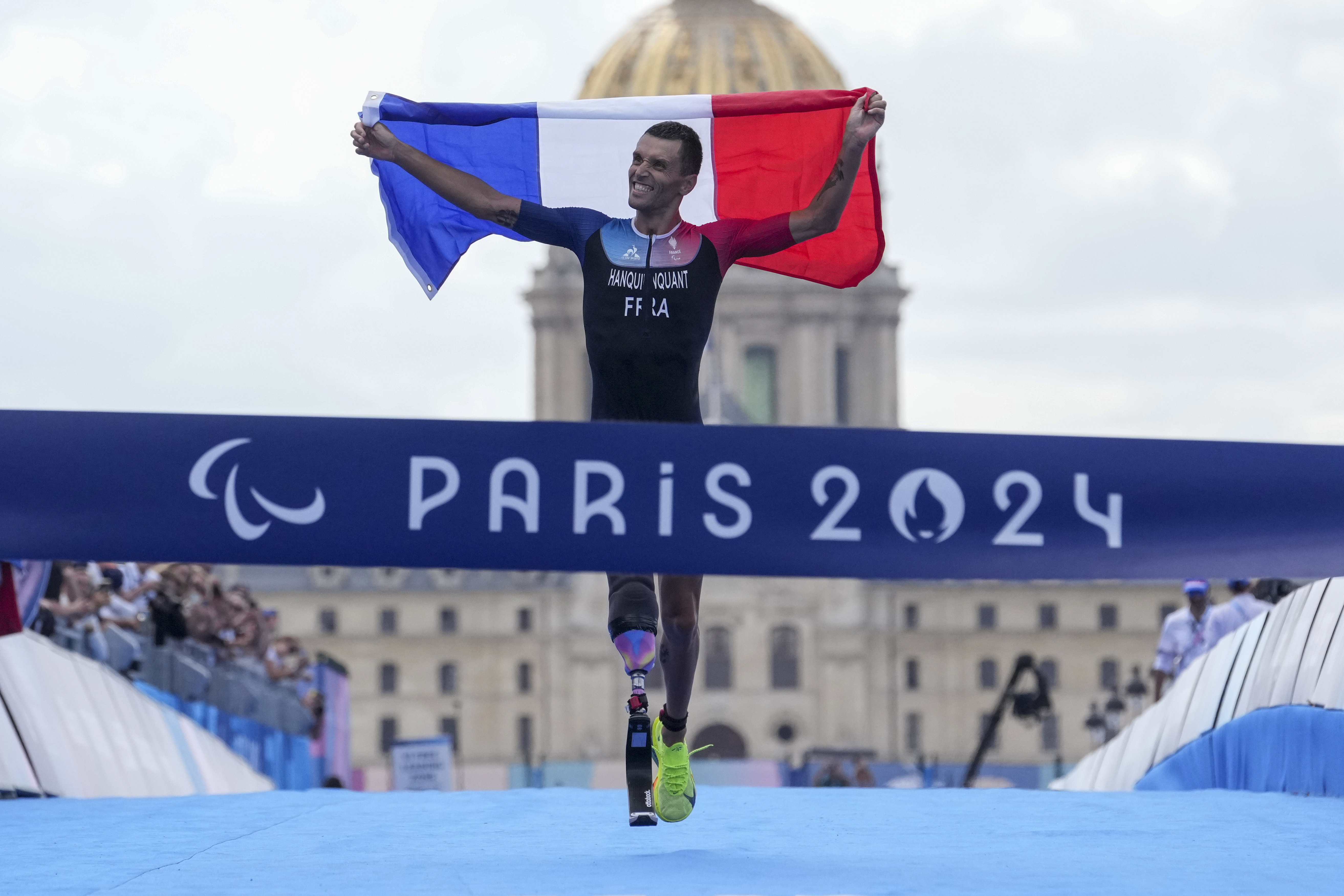 France's Alexis Hanquinquant wins the men's PTS4 Triathlon at the 2024 Paralympics, Monday, Sept. 2, 2024, in Paris, France.