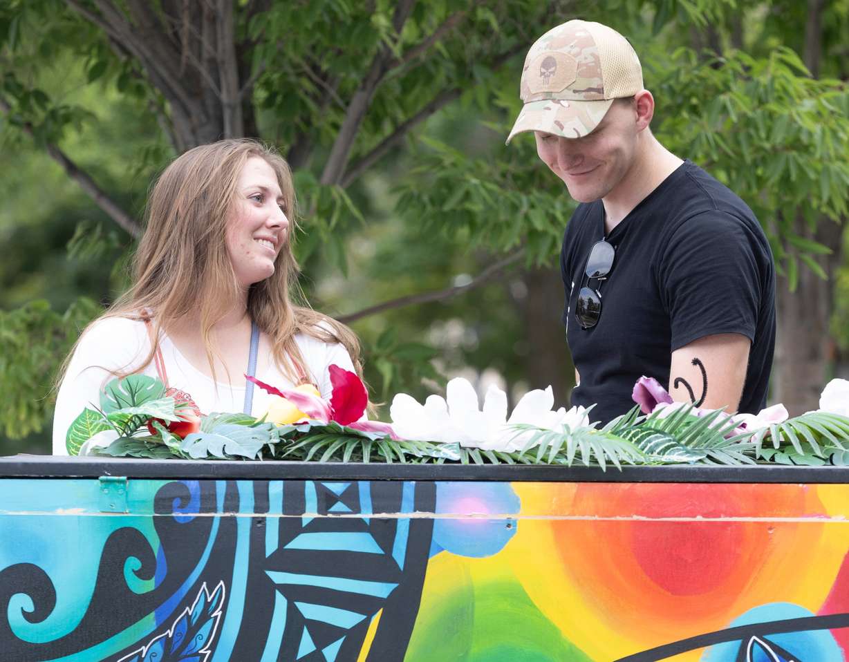 Emma Hibbits, from Colrado Springs Colorado, looks at her boyfriend Carson Hurst, from Grantsville, while he plays on one of the pianos in front Maurice Abravanel Hall in Salt Lake City on Aug. 10. Hibbits and Hurst said that playing around with the pianos was the last stop on their date in Salt Lake City.