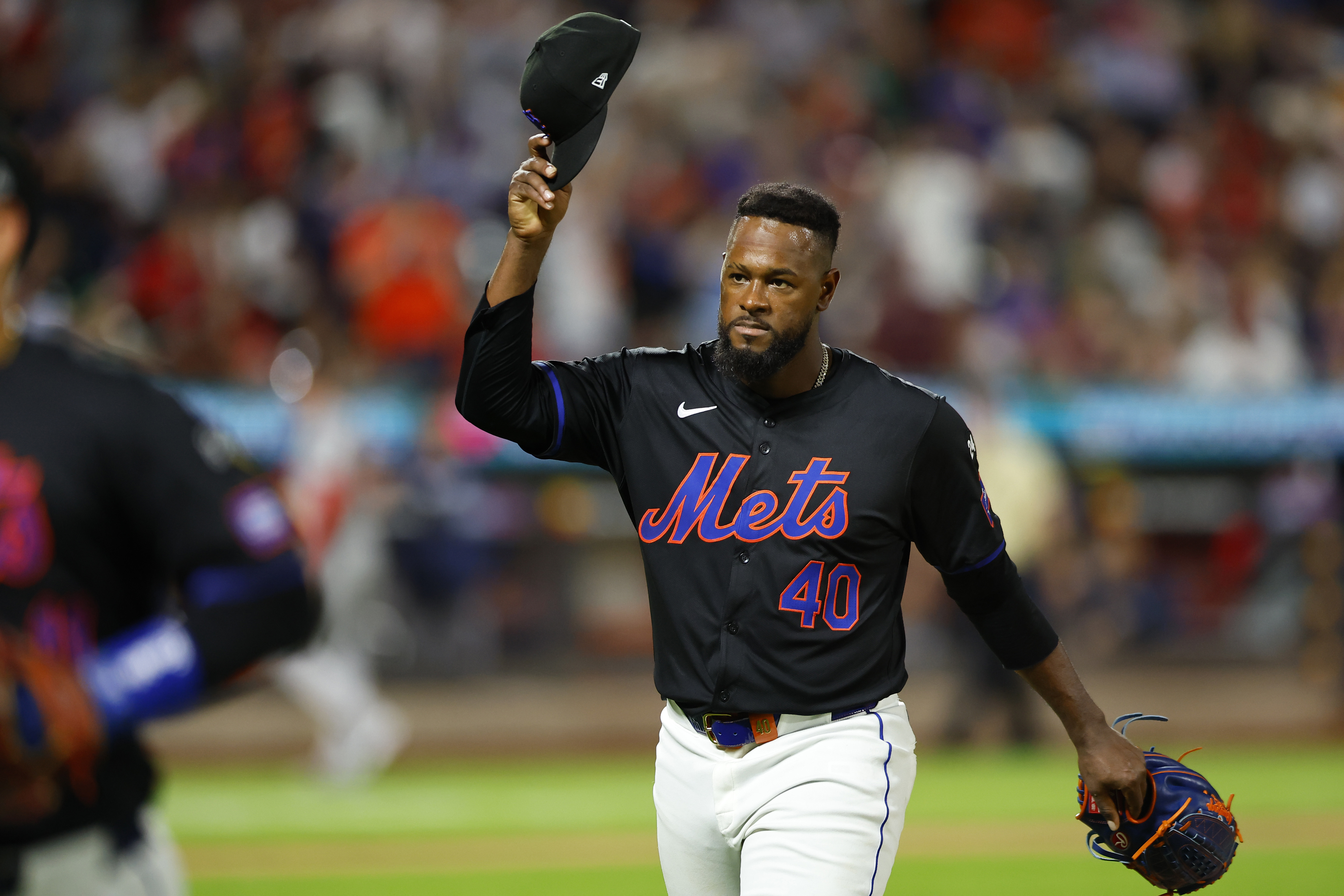 New York Mets pitcher Luis Severino tips his cap to fans on his way to the dugout during the seventh inning of a baseball game against the Boston Red Sox, Monday, Sept. 2, 2024, in New York. 