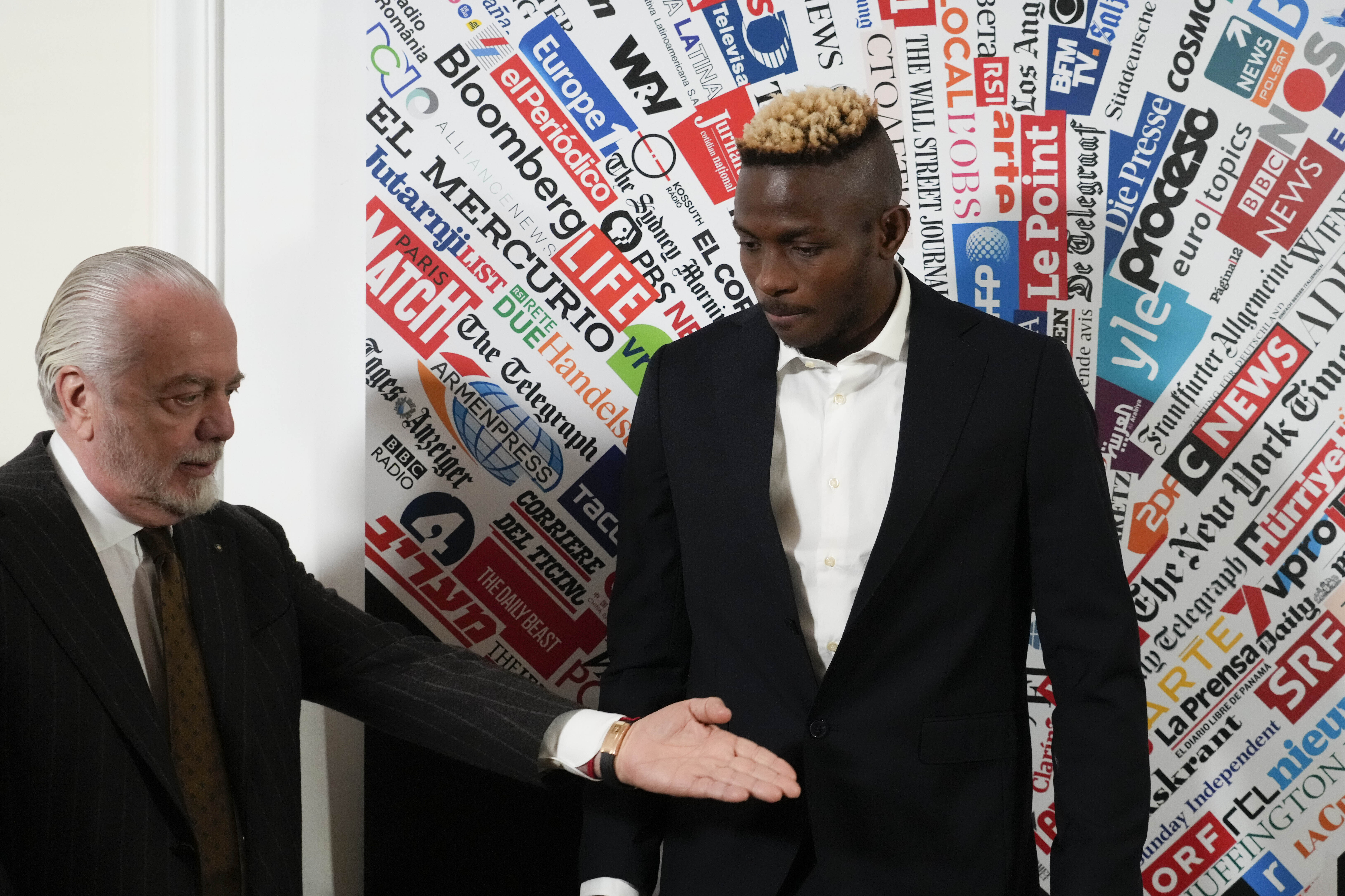 FILE - SS Napoli striker Victor Osimhen, right, arrives with team President Aurelio De Laurentiis, at the Foreign Press club to receive the "Best Foreign Athlete of the Year" award, in Rome, Monday, March 6, 2023. 